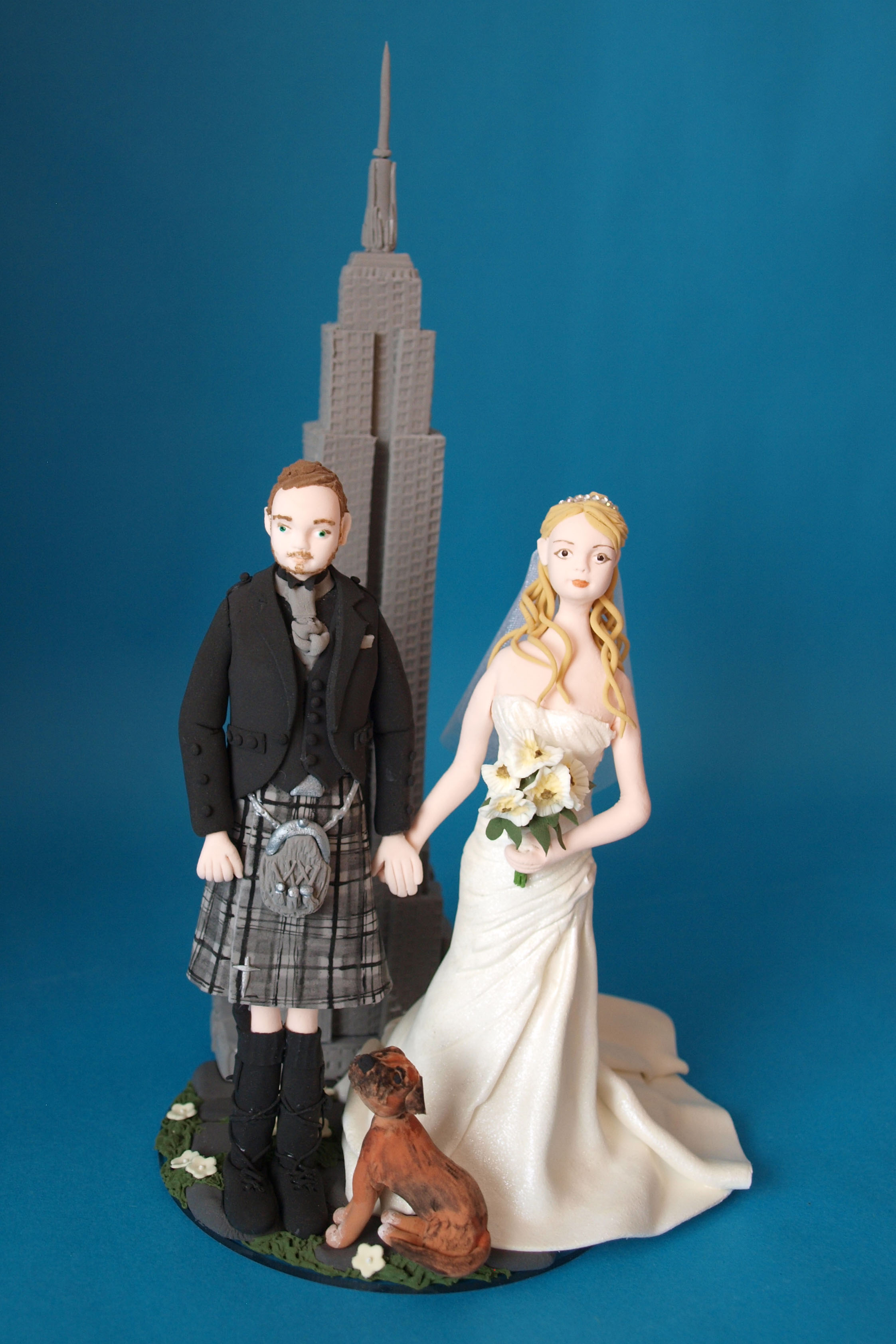 Bride and groom with dog and Empire State Building wedding cake topper by Louisa Hill