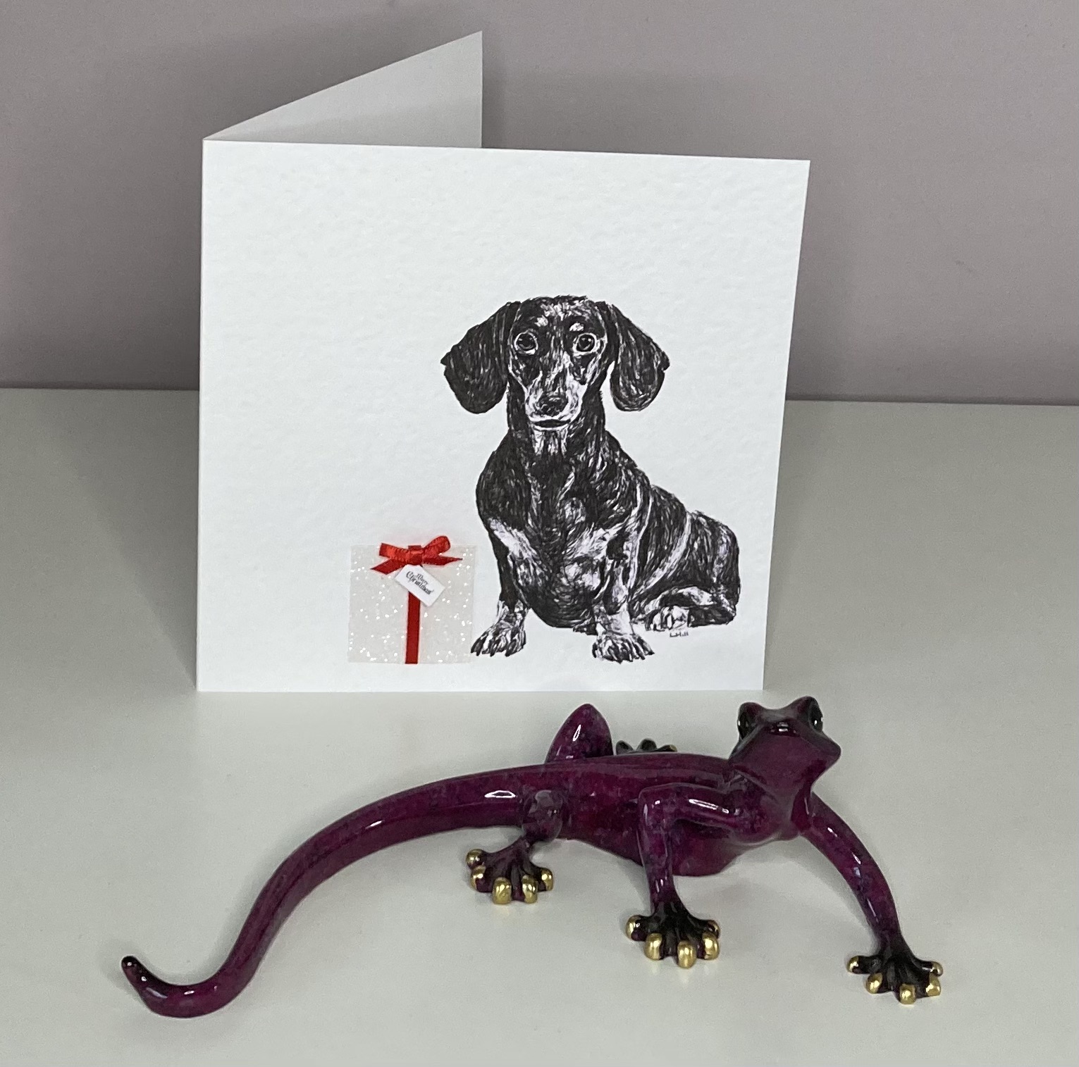 Dachshund in Christmas present Christmas cards by Louisa Hill