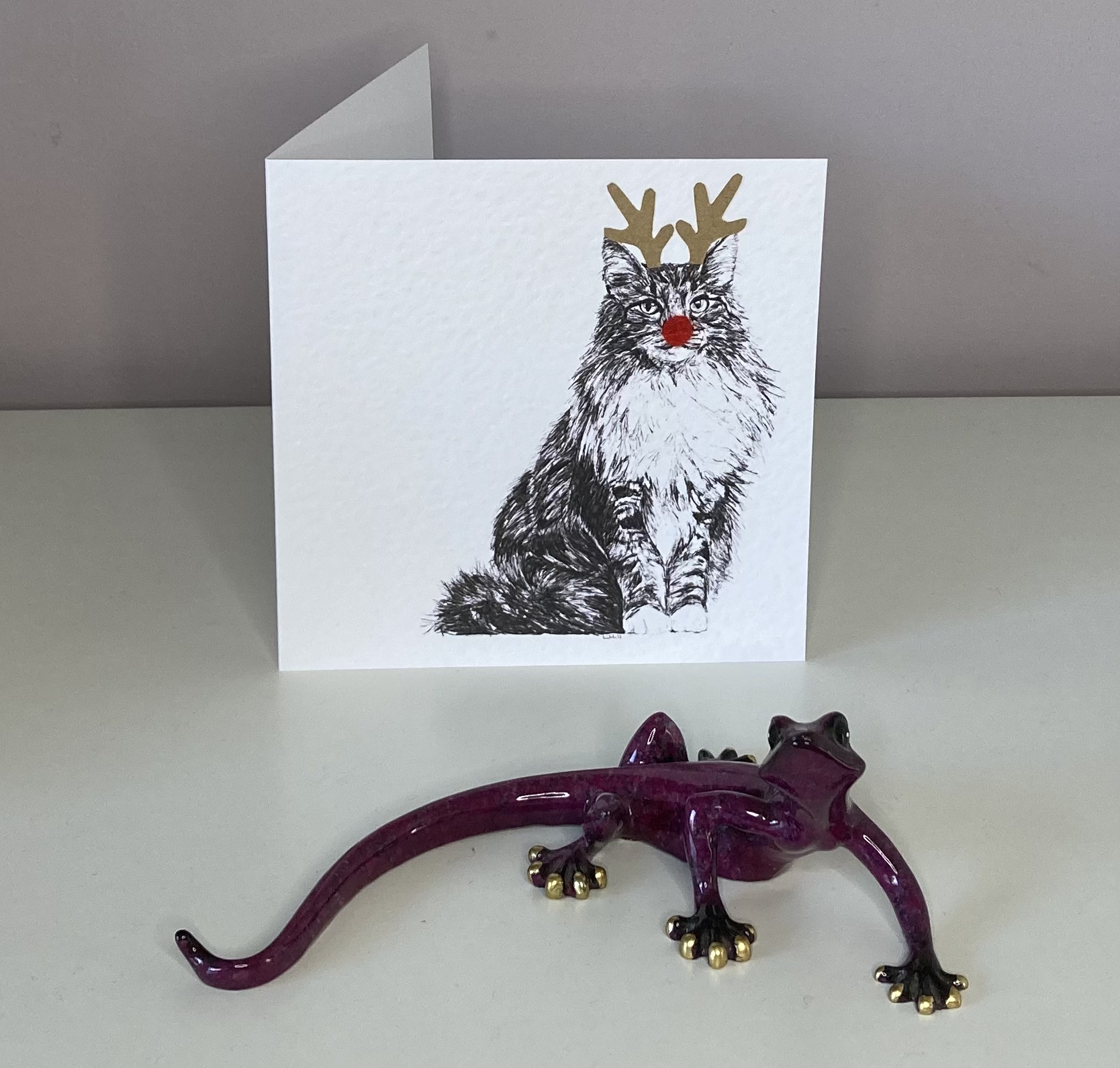 Norwegian Forest with reindeer antlers and red nose Christmas card by Louisa Hill