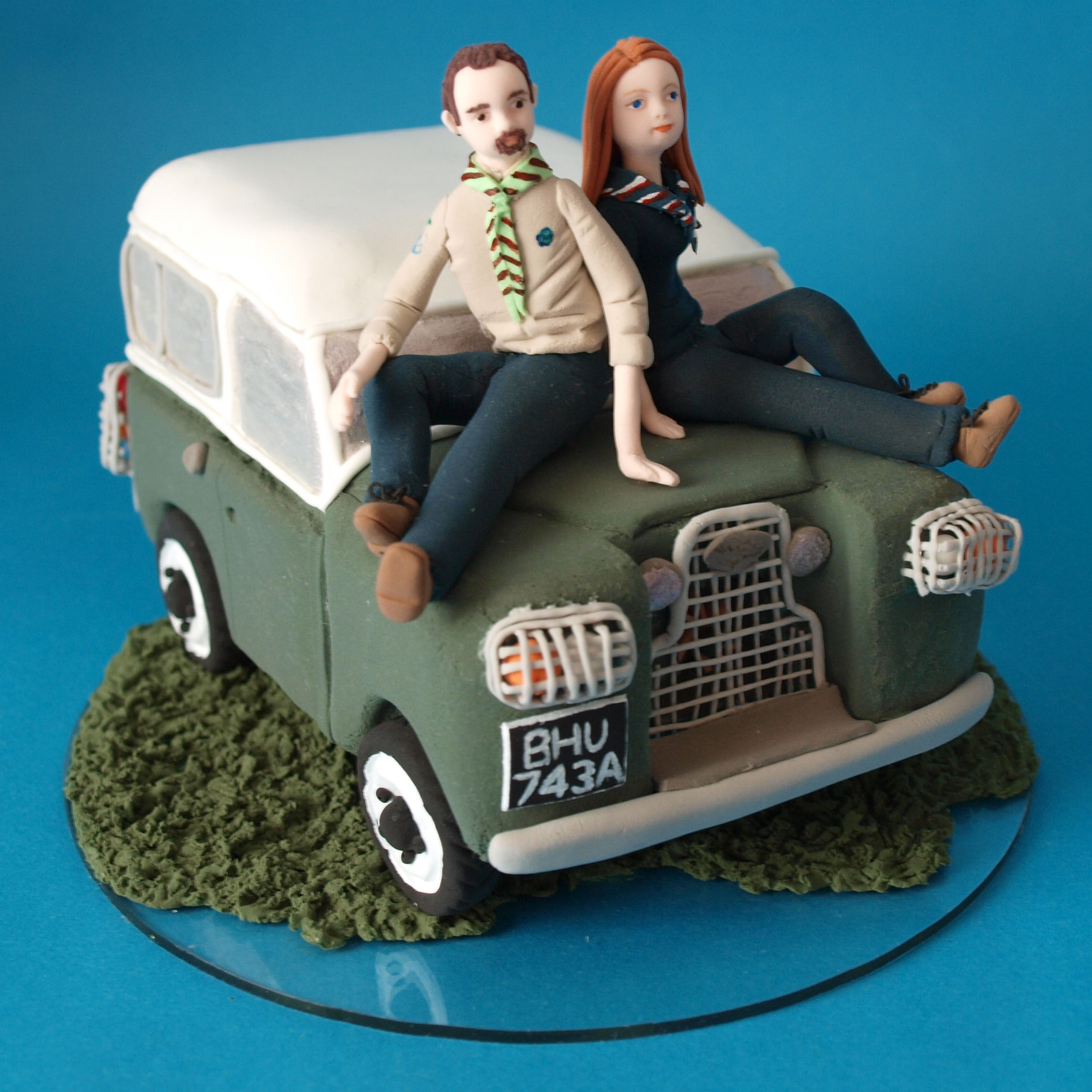 Small bride and groom with Landrover  wedding cake topper by Louisa Hill