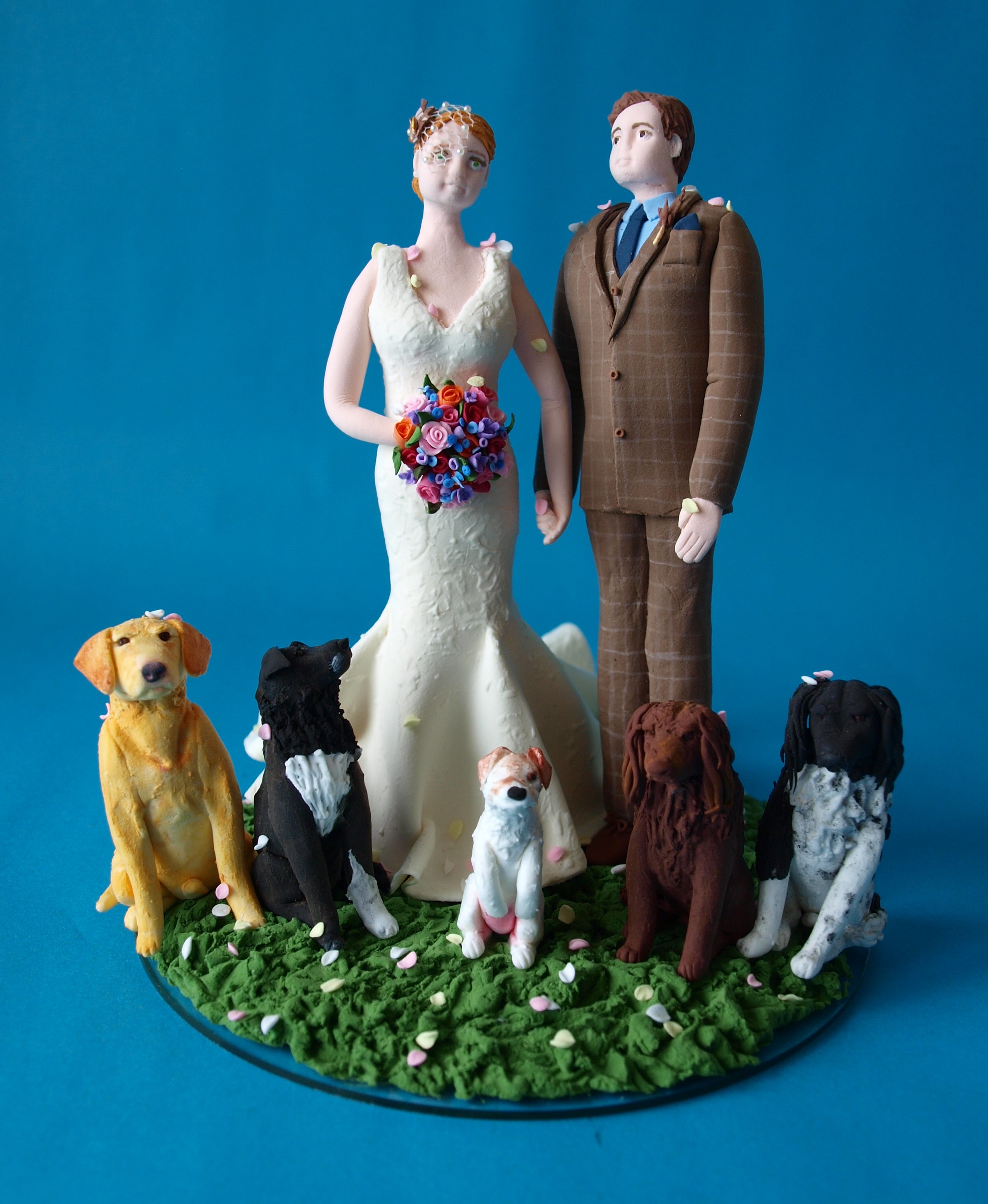 Bride and groom with 5 dogs wedding cake topper by Louisa Hill