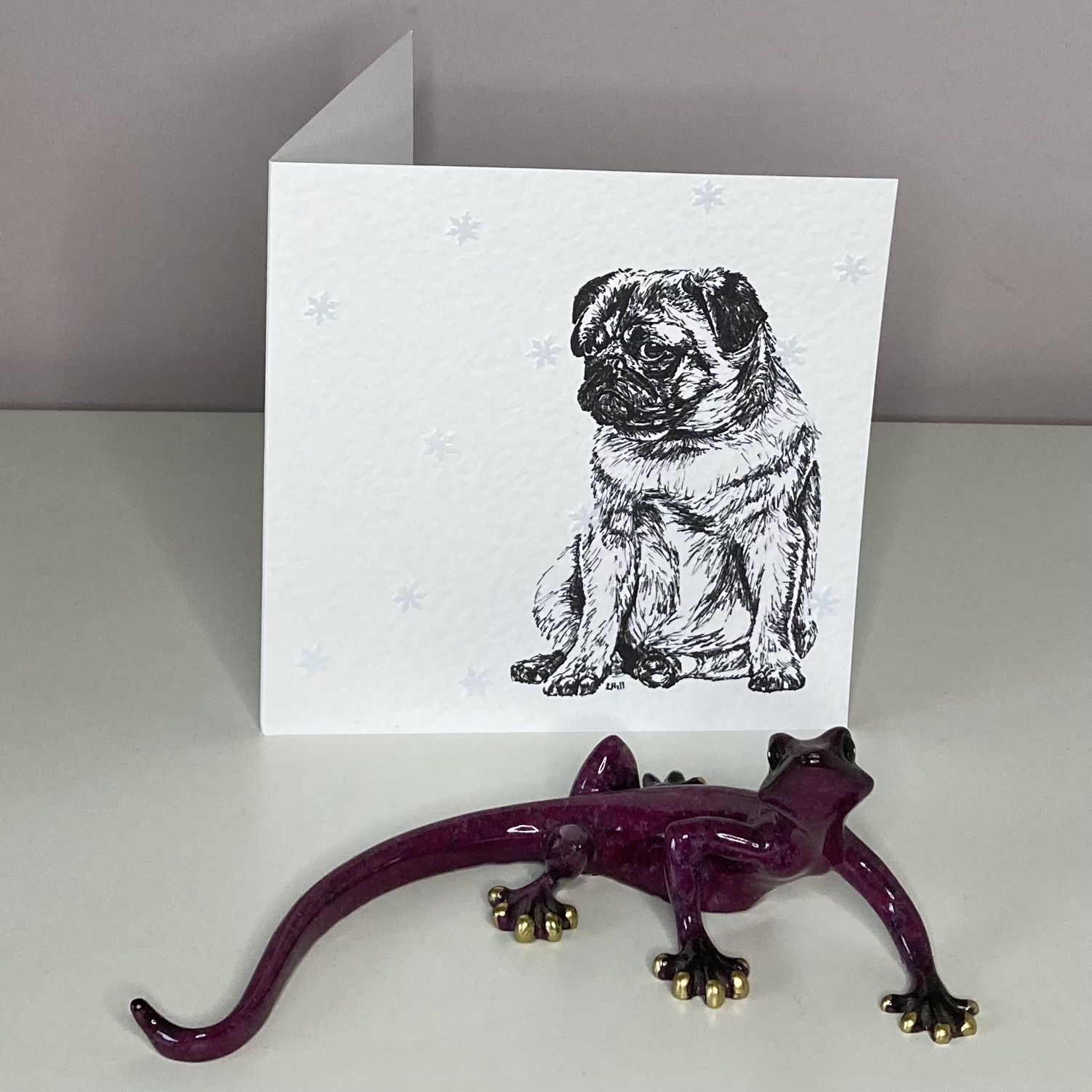 Pug with snowflakes Christmas card by Louisa Hill