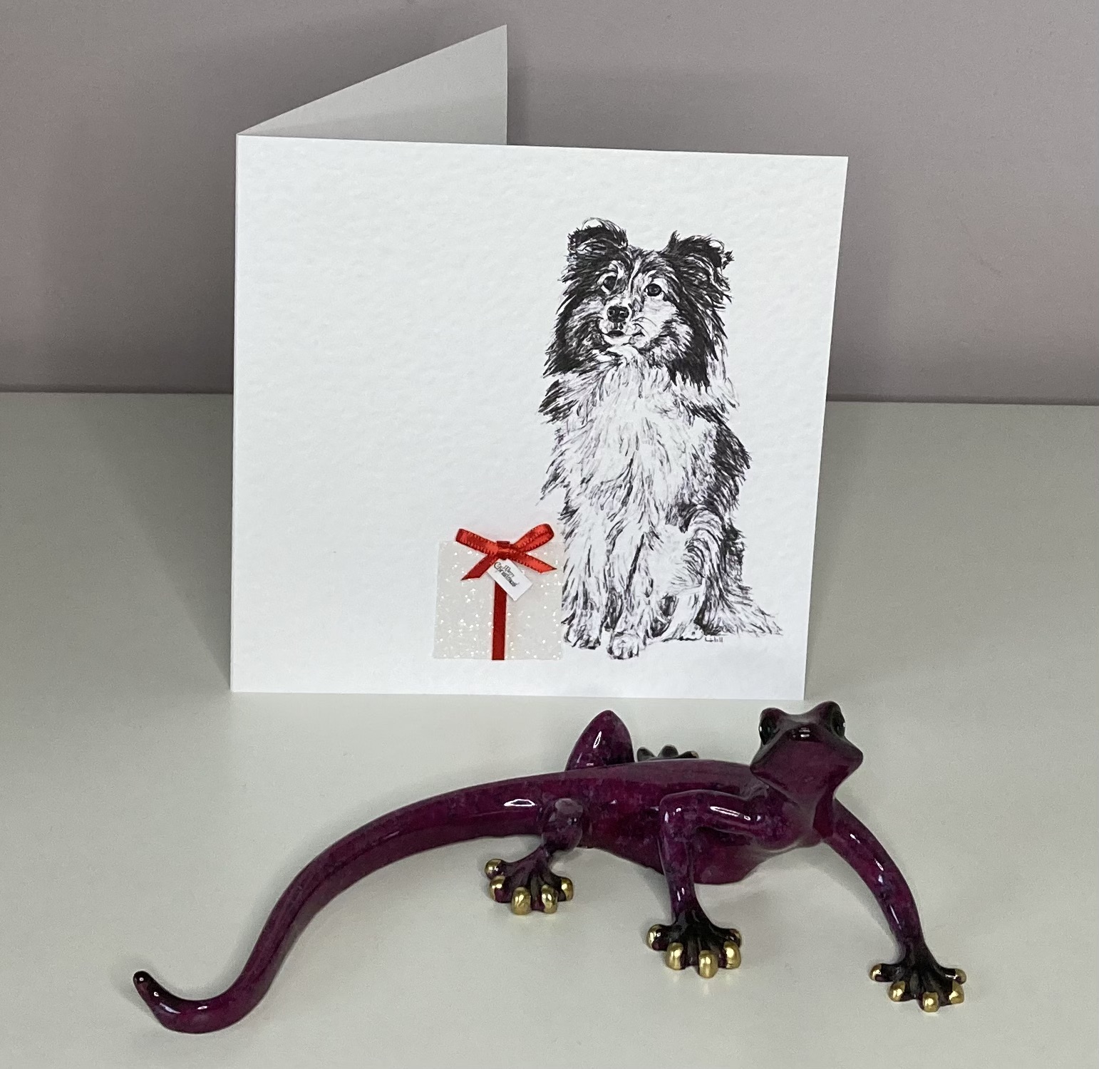 Shetland Sheepdog with Christmas present Christmas card by Louisa Hill