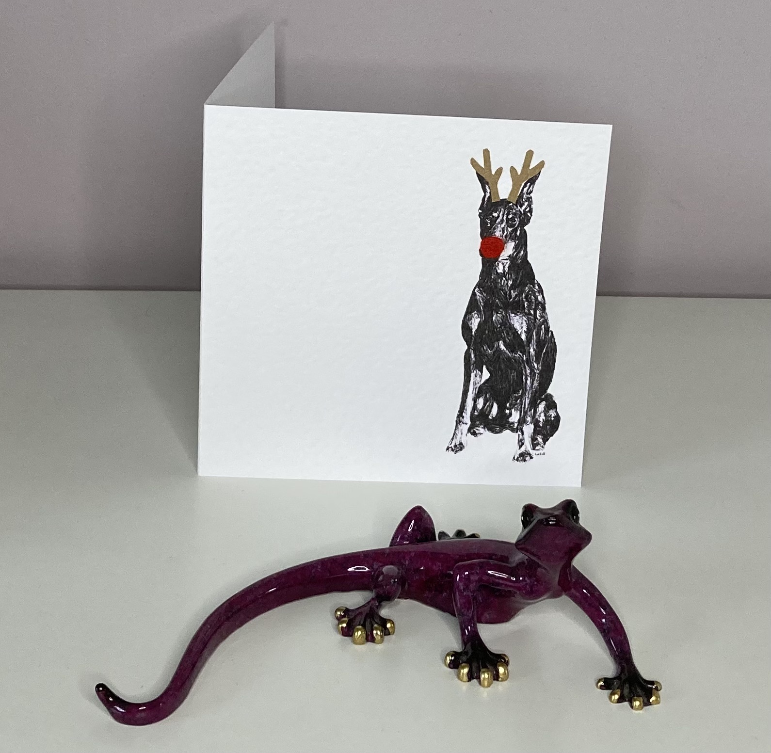 Doberman Pinscher with reindeer antlers and red nose  Christmas card by Louisa Hill