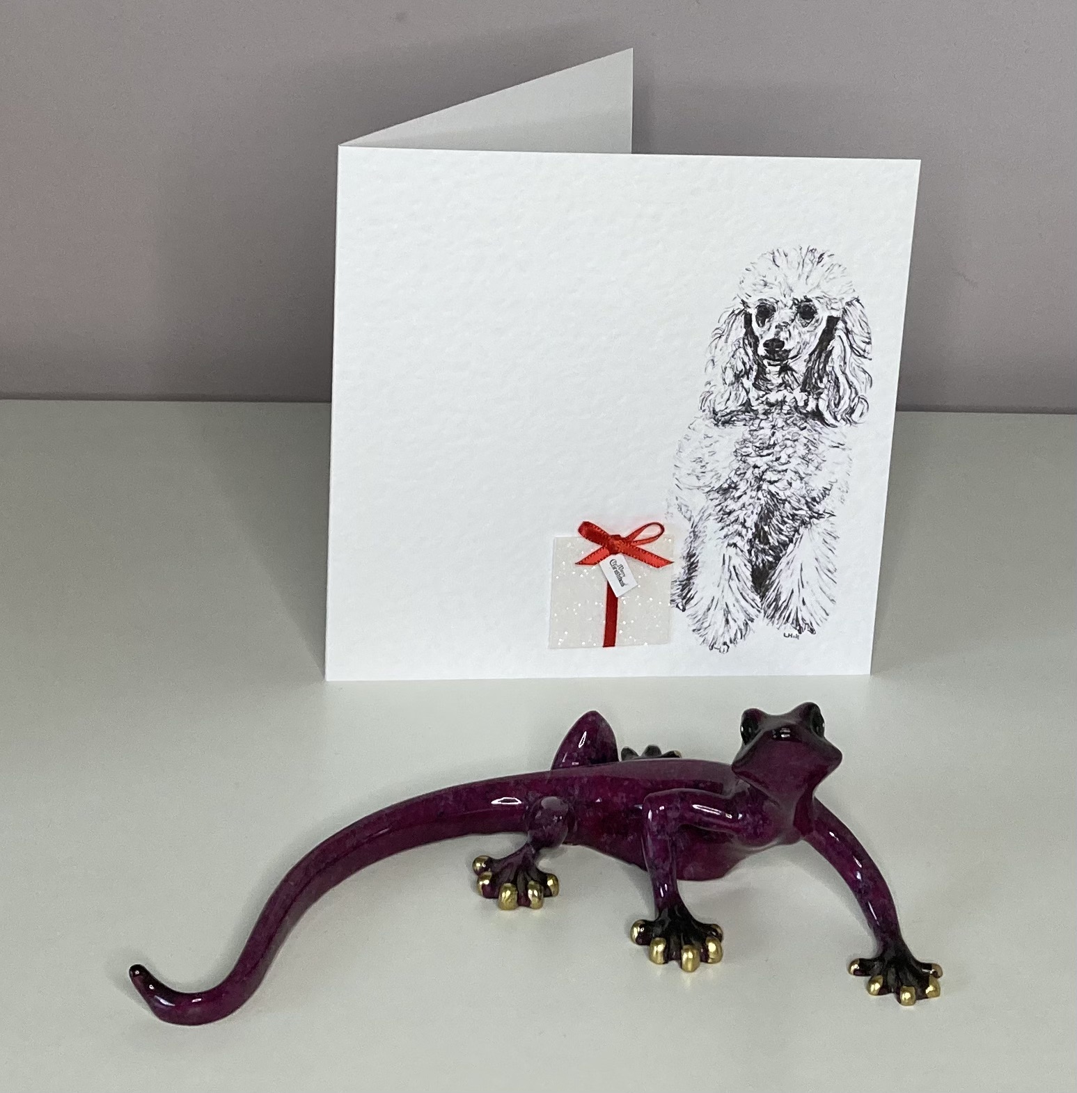 Poodle with Christmas present Christmas cards by Louisa Hill