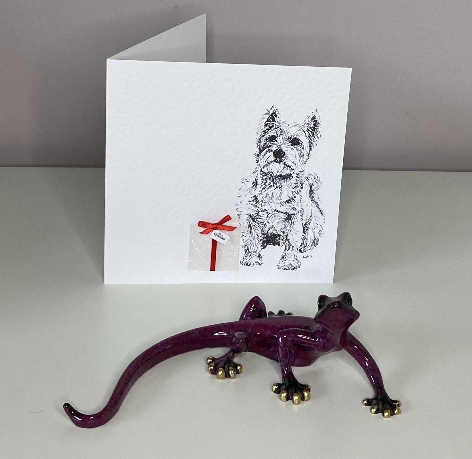 West Highland Terrier with Christmas present Christmas card by Louisa Hill