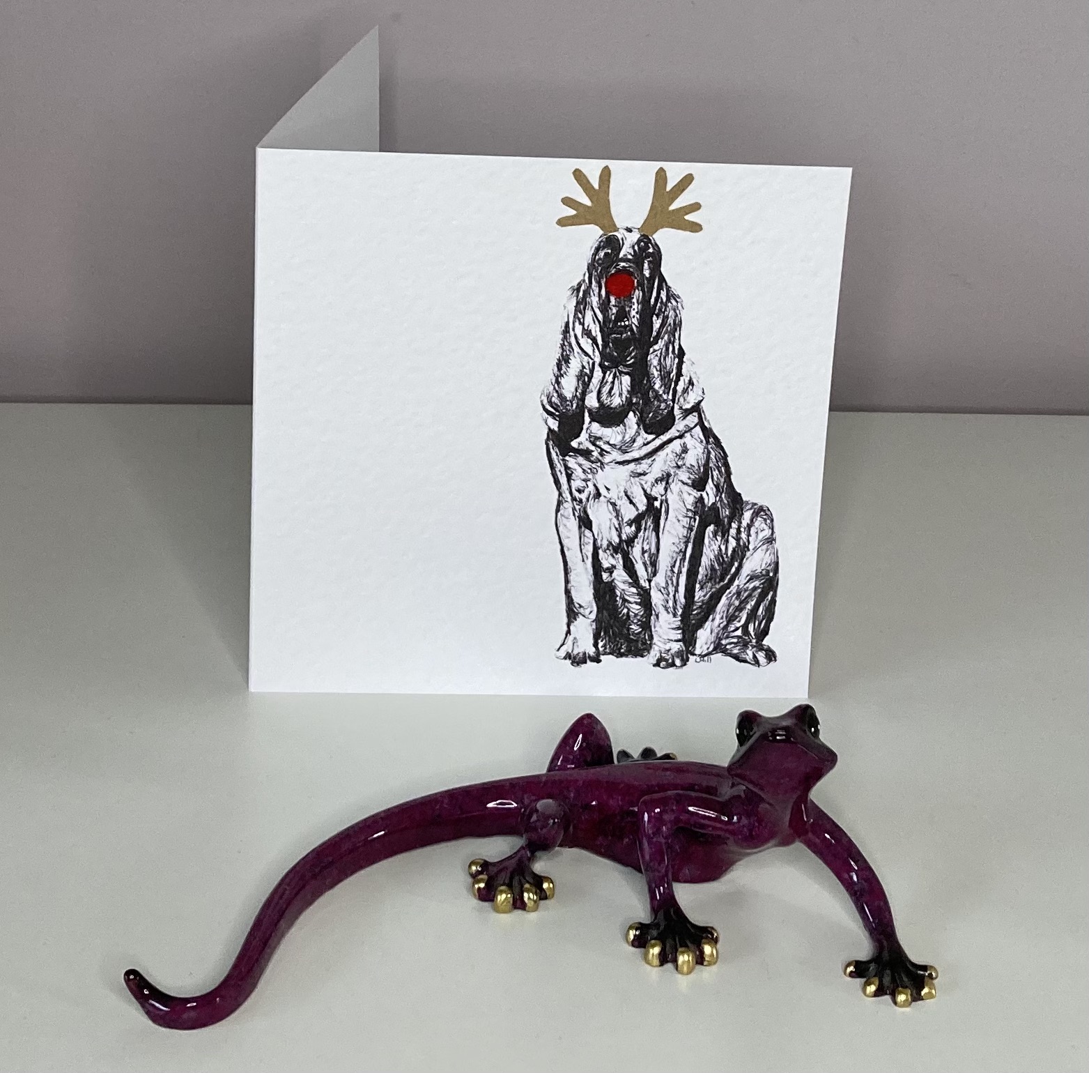 Bloodhound with reindeer antlers and red nose Christmas card by Louisa Hill