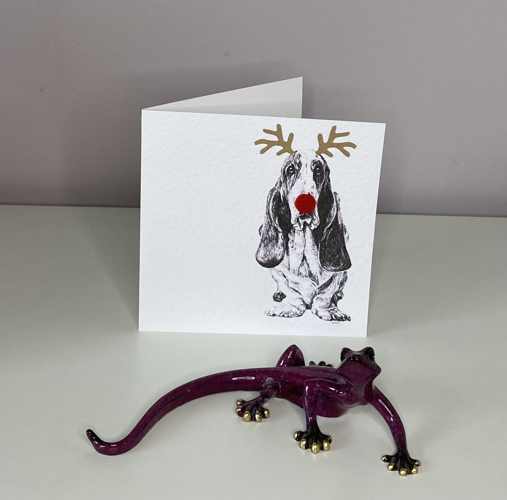 Basset Hound with reindeer antlers and red nose Christmas card by Louisa Hill