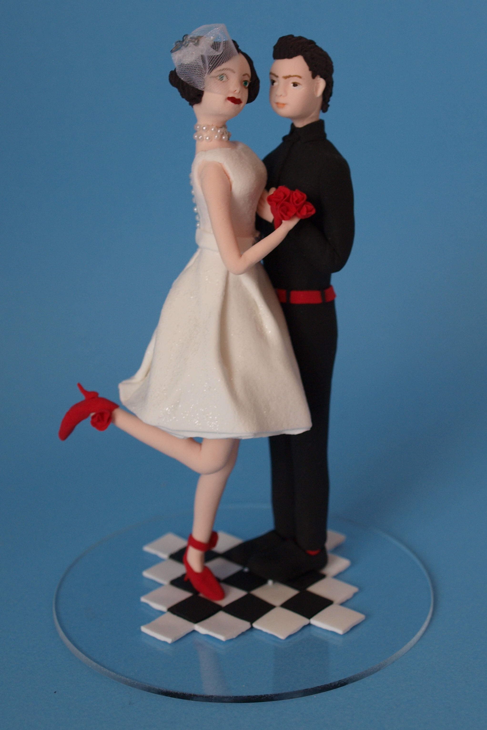 Bride and groom wedding cake topper by Louisa Hill