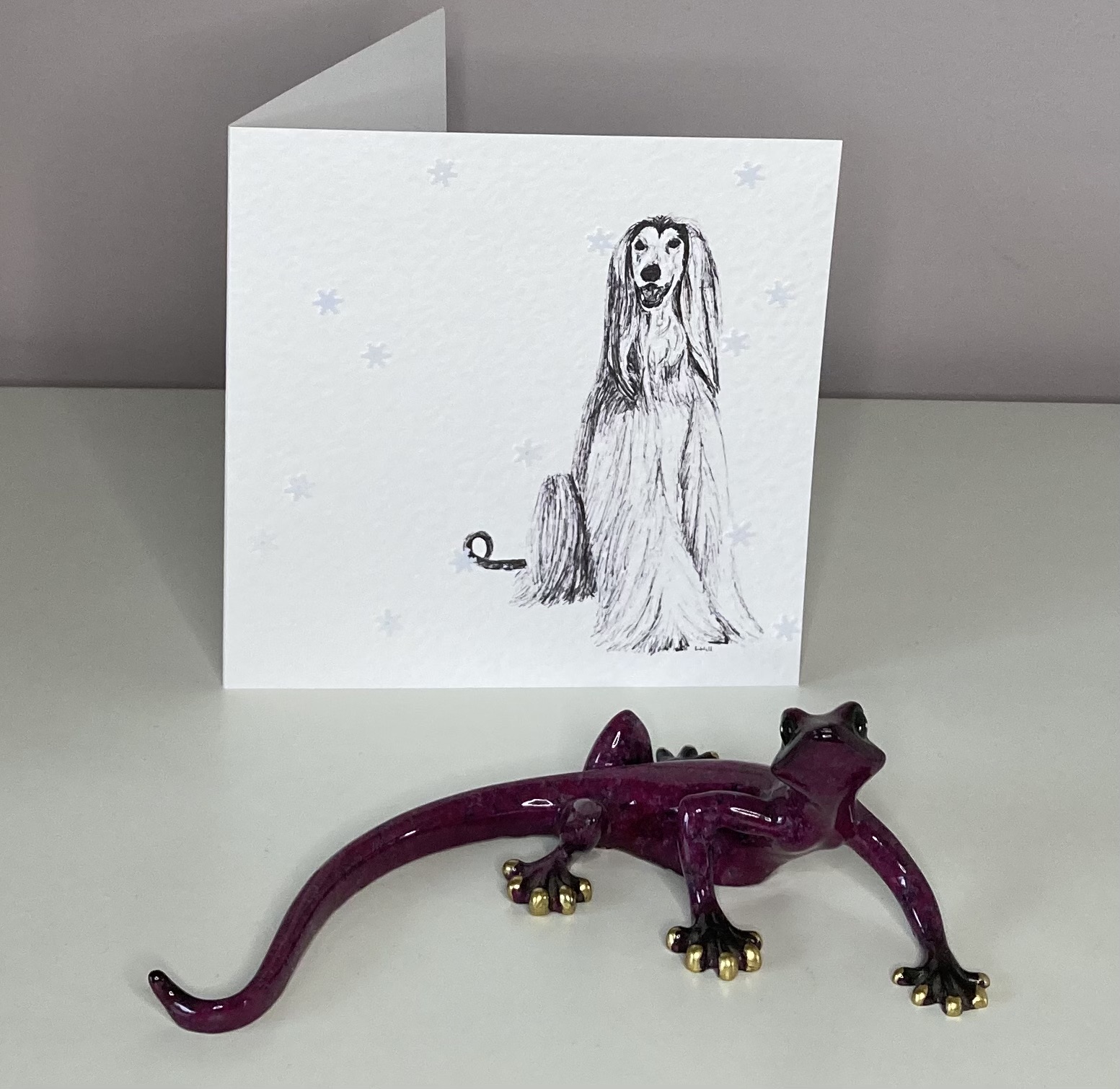 Afghan Hound with snowflakes Christmas card by Louisa Hill