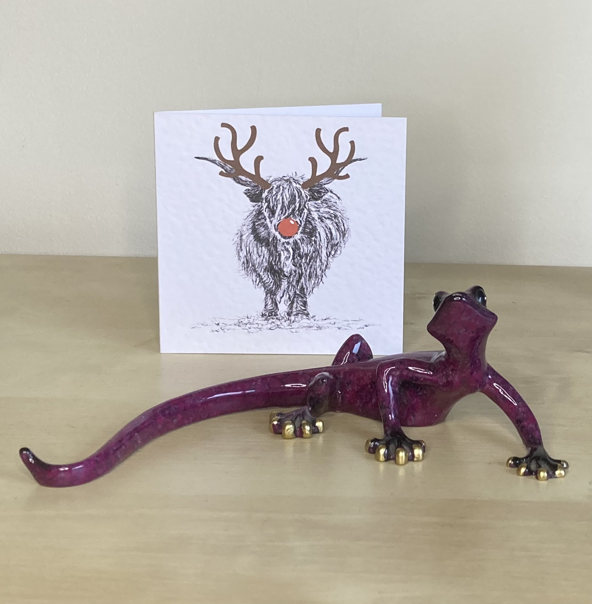 Highland Cattle with reindeer antlers and red nose Christmas card by Louisa Hill