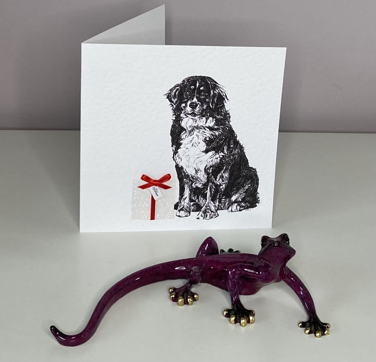 Bernese Mountain with Christmas present Christmas card by Louisa Hill