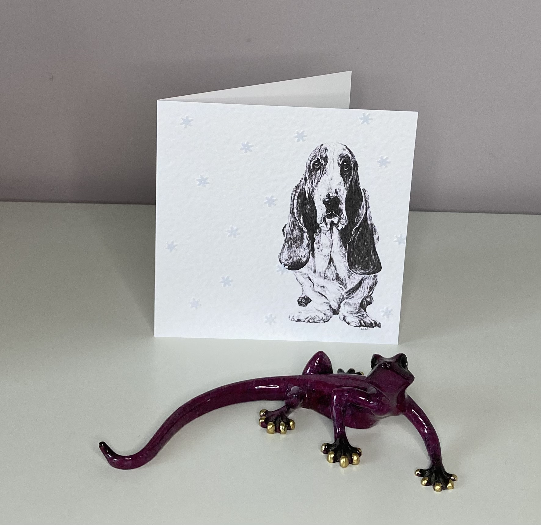 Basset Hound with snowflakes Christmas card by Louisa Hill