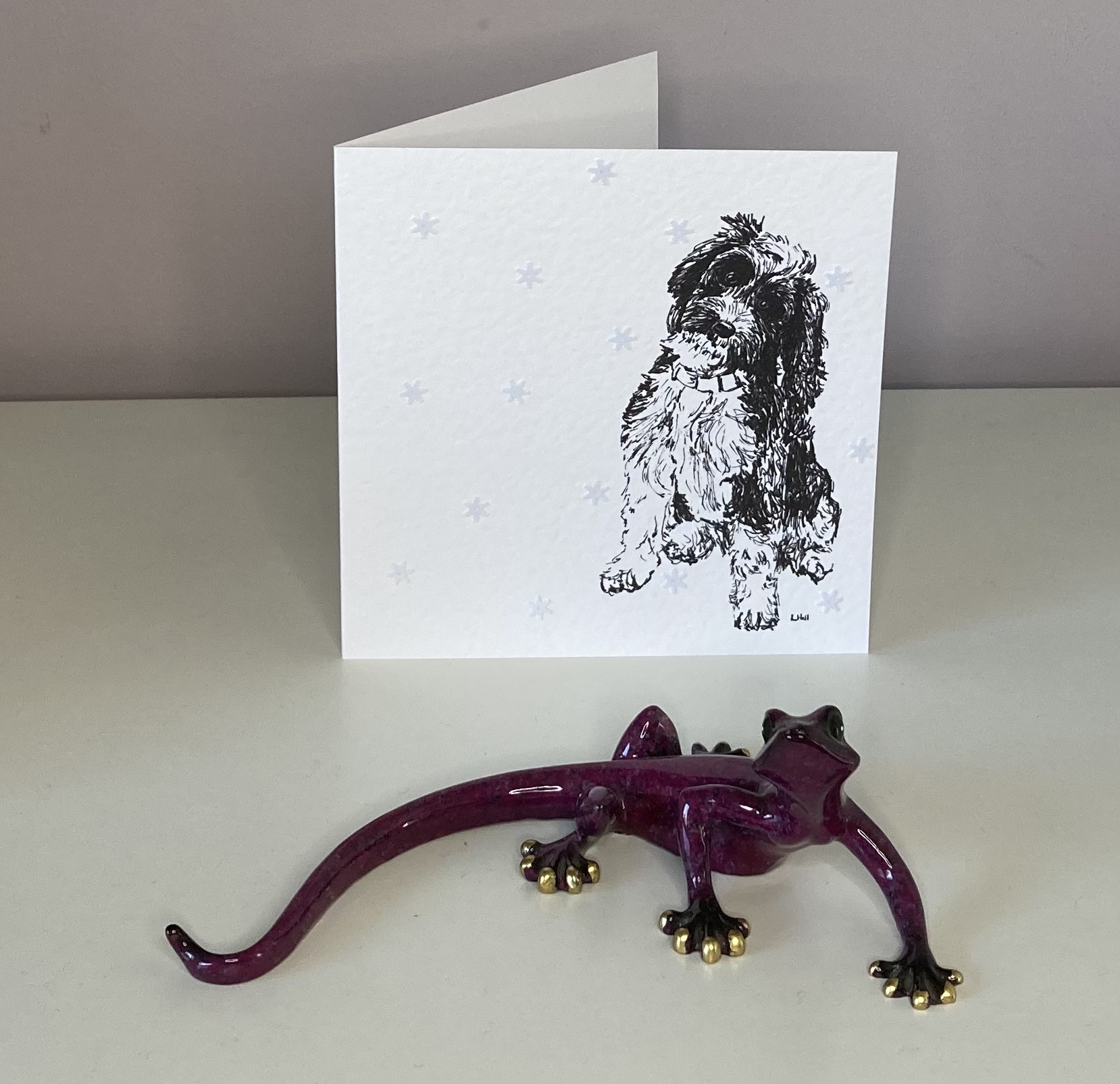 Cockapoo with snowflakes Christmas card by Louisa Hill