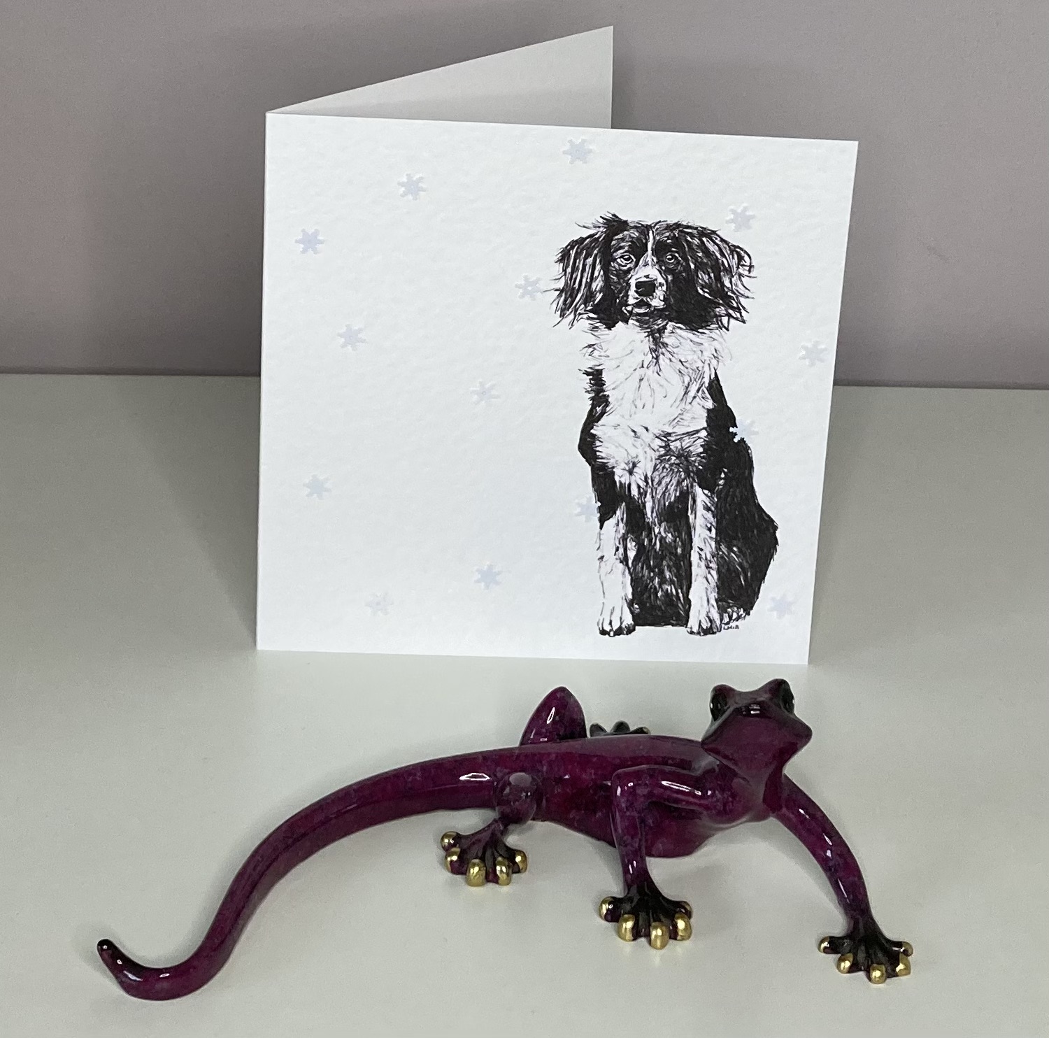 Sprollie with snowflakes Christmas card by Louisa Hill