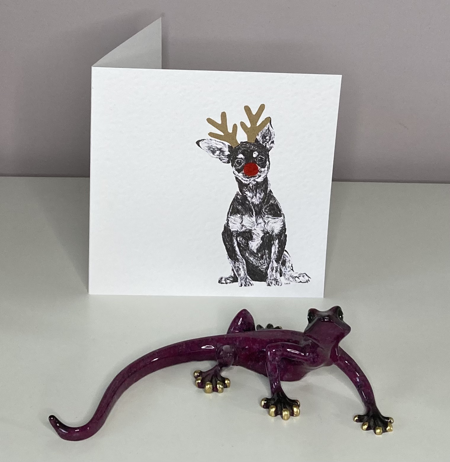 Chihuahua with reindeer antlers and red nose Christmas card by Louisa Hill