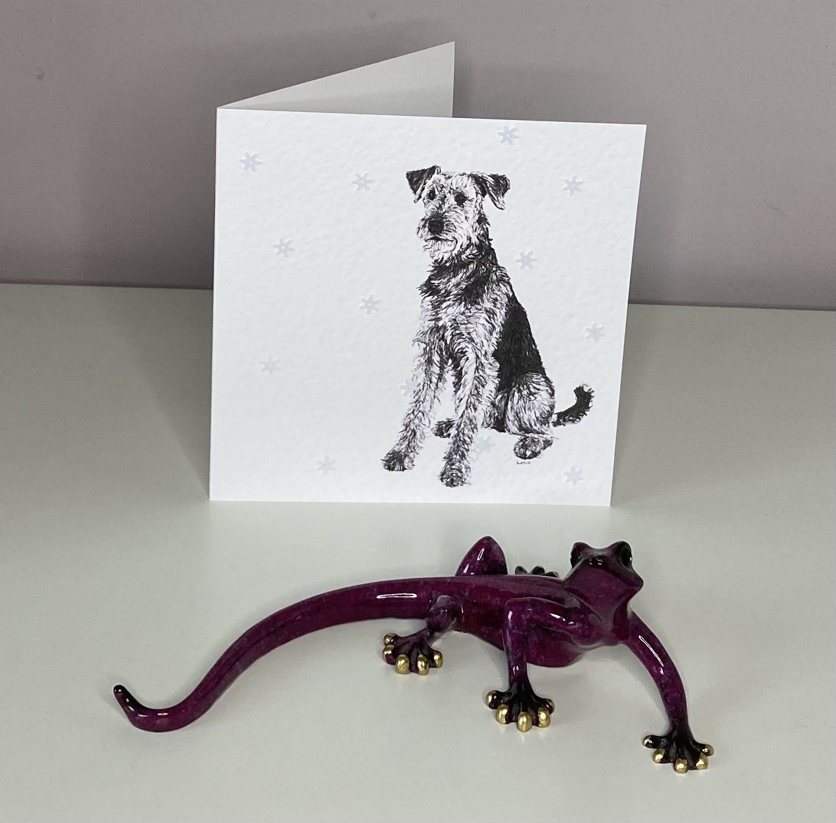 Airedale Terrier with snowflakes Christmas card by Louisa Hill