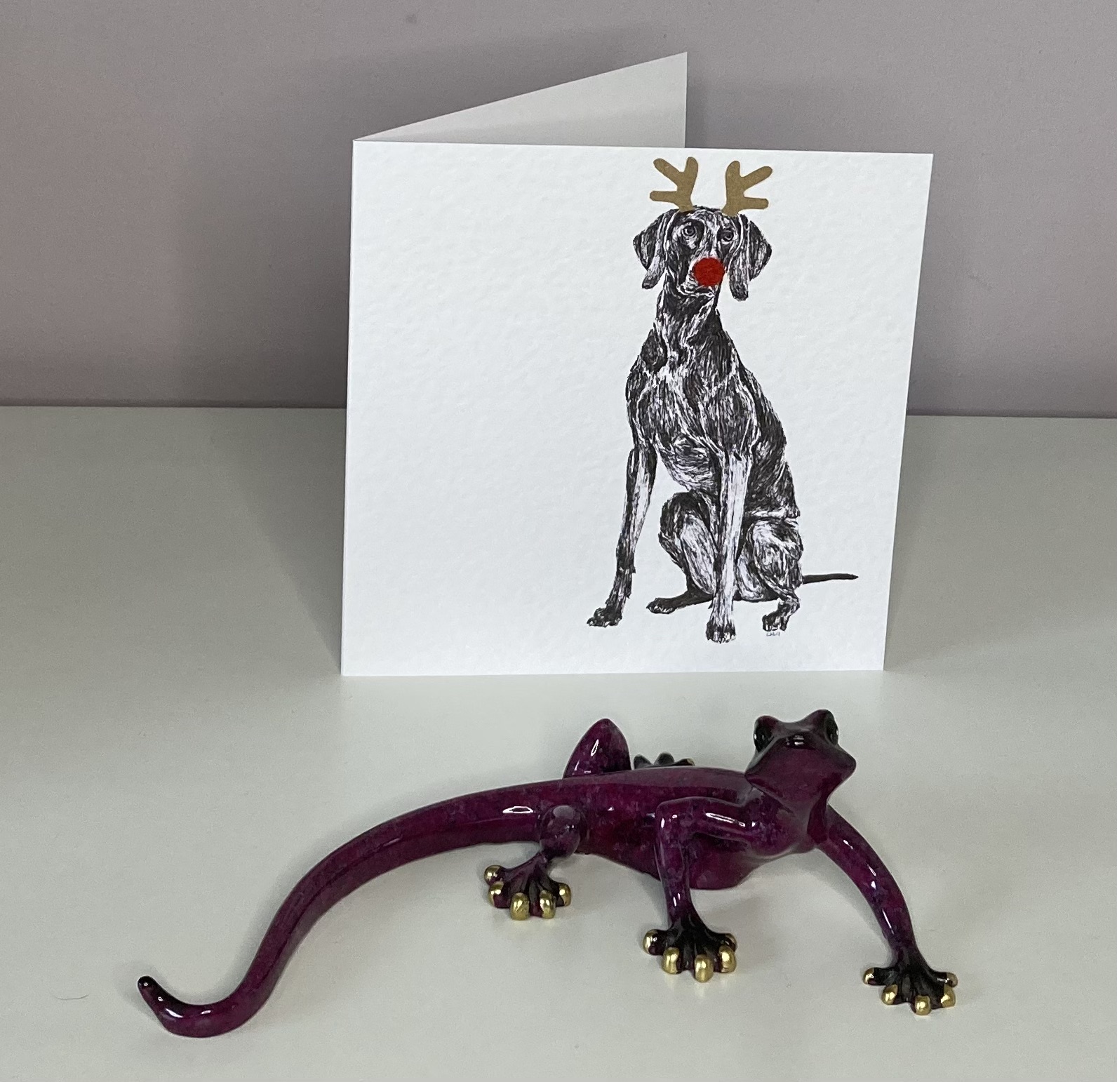 Weimaraner with reindeer antlers and red nose Christmas card by Louisa Hill