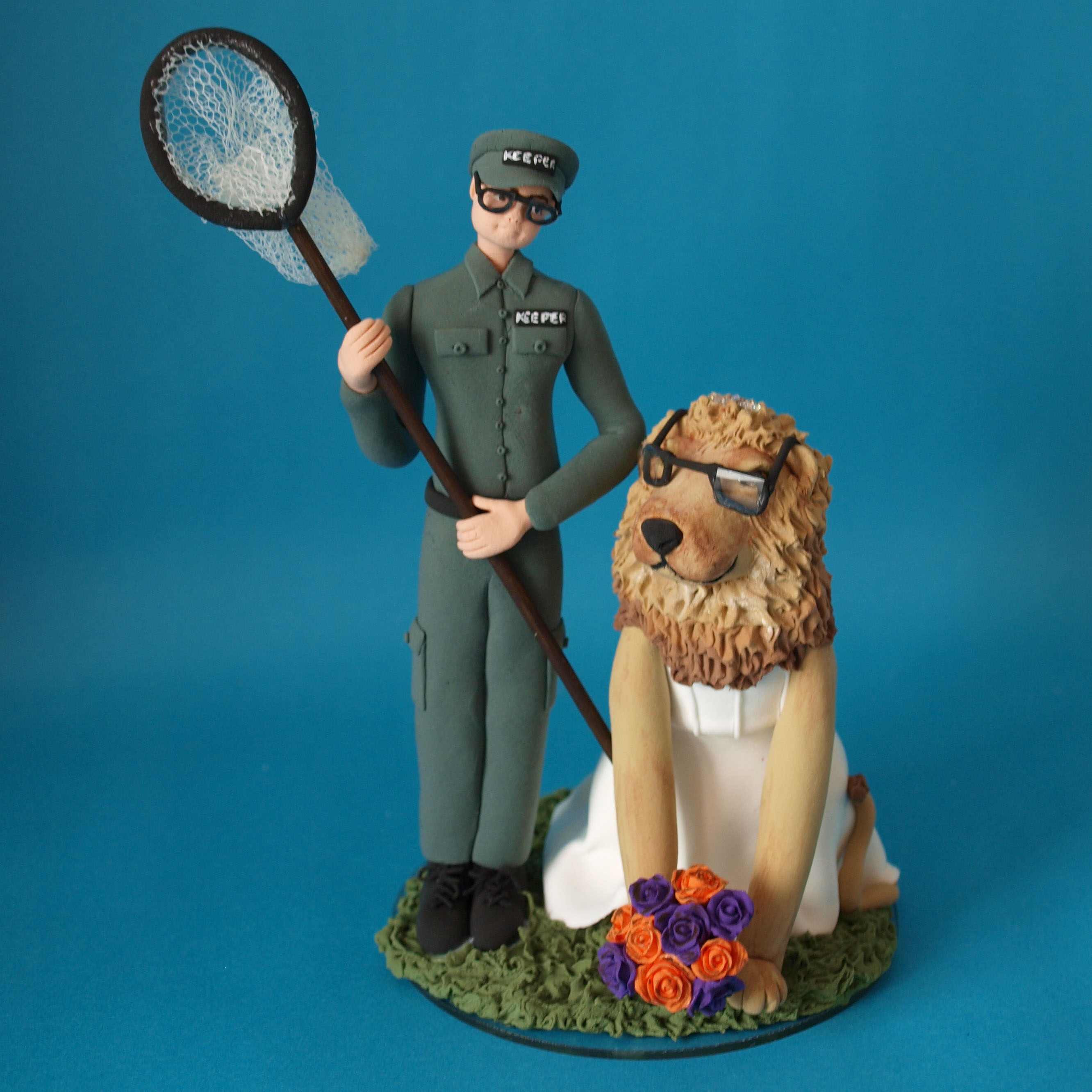 Lion bride and groom wedding cake topper by Louisa Hill