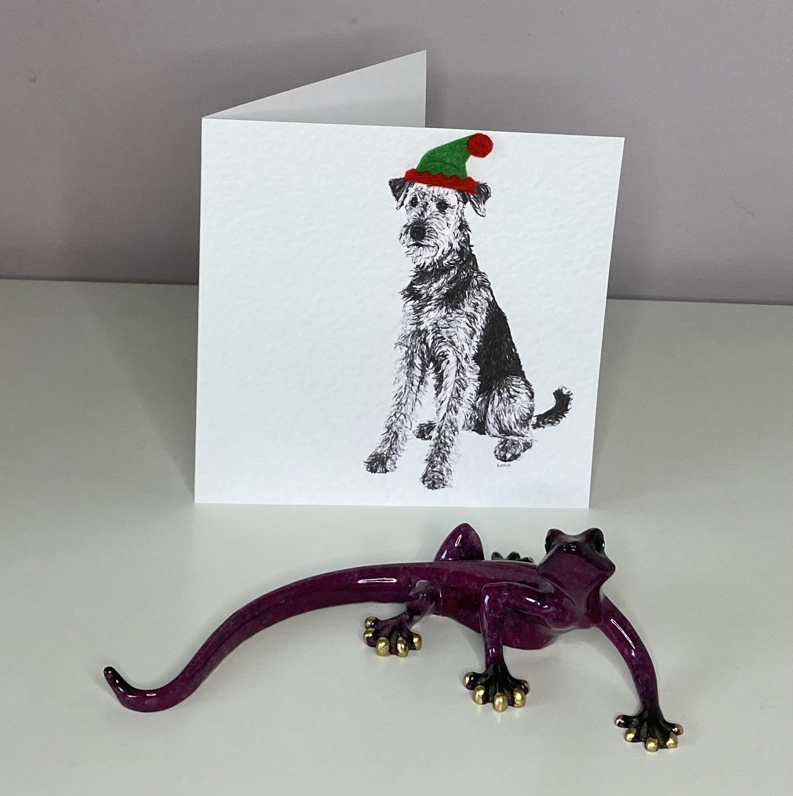 Airedale Terrier with elf hat Christmas card by Louisa Hill