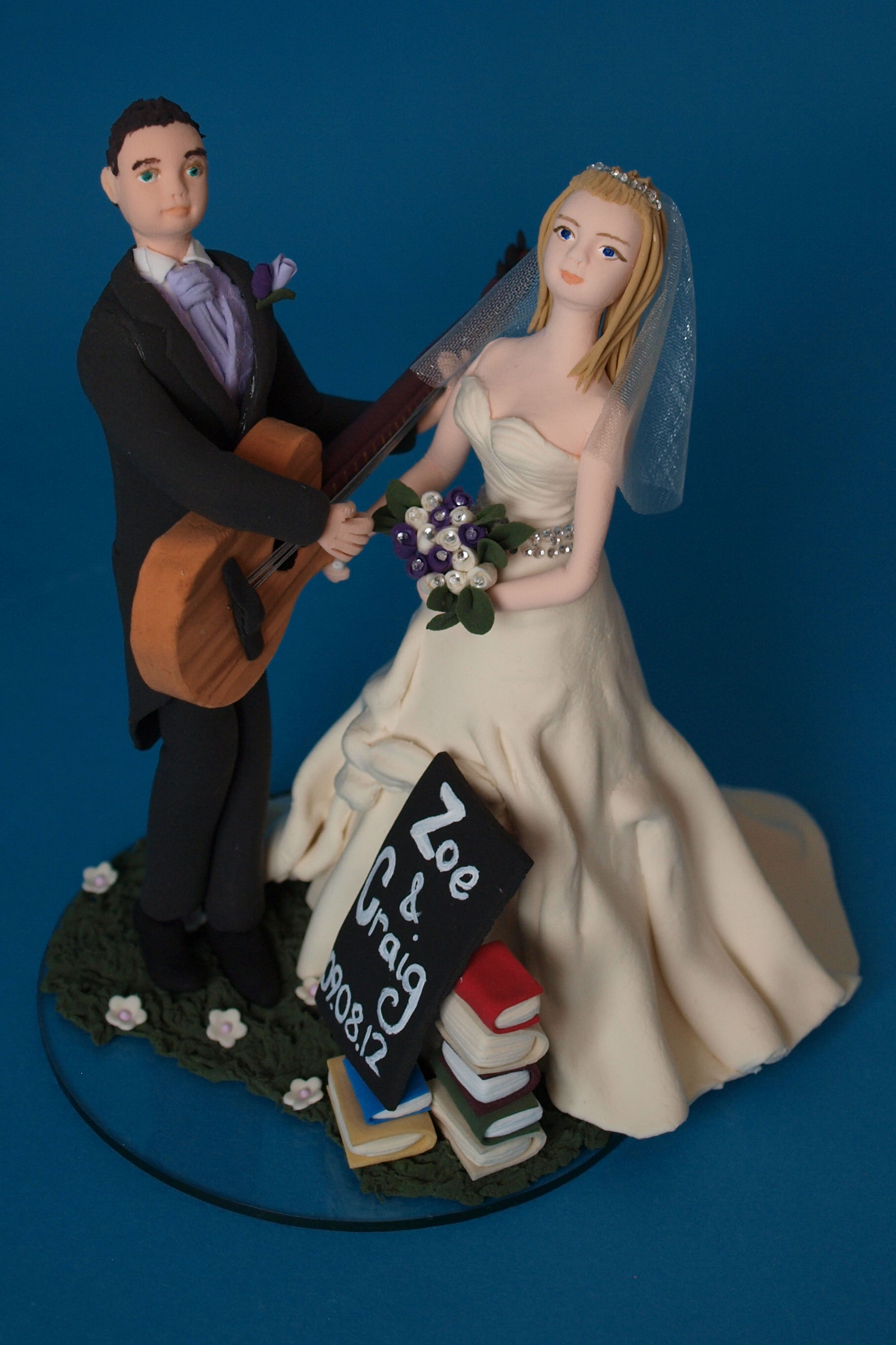 Bride and groom with guitar and books wedding cake topper with cats by Louisa Hill