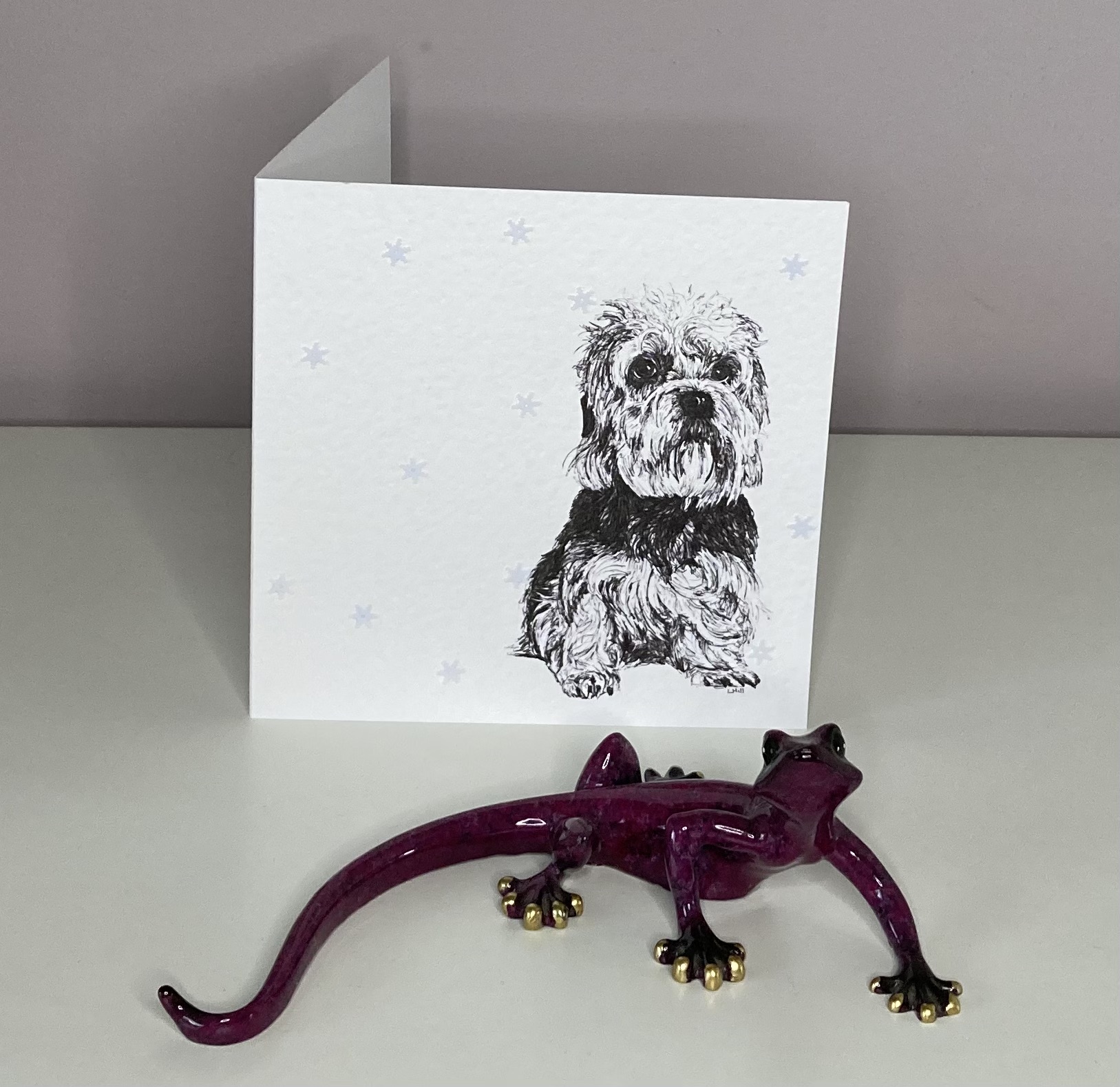 Dandie Dinmont Terrier with snowflakes Christmas card by Louisa Hill