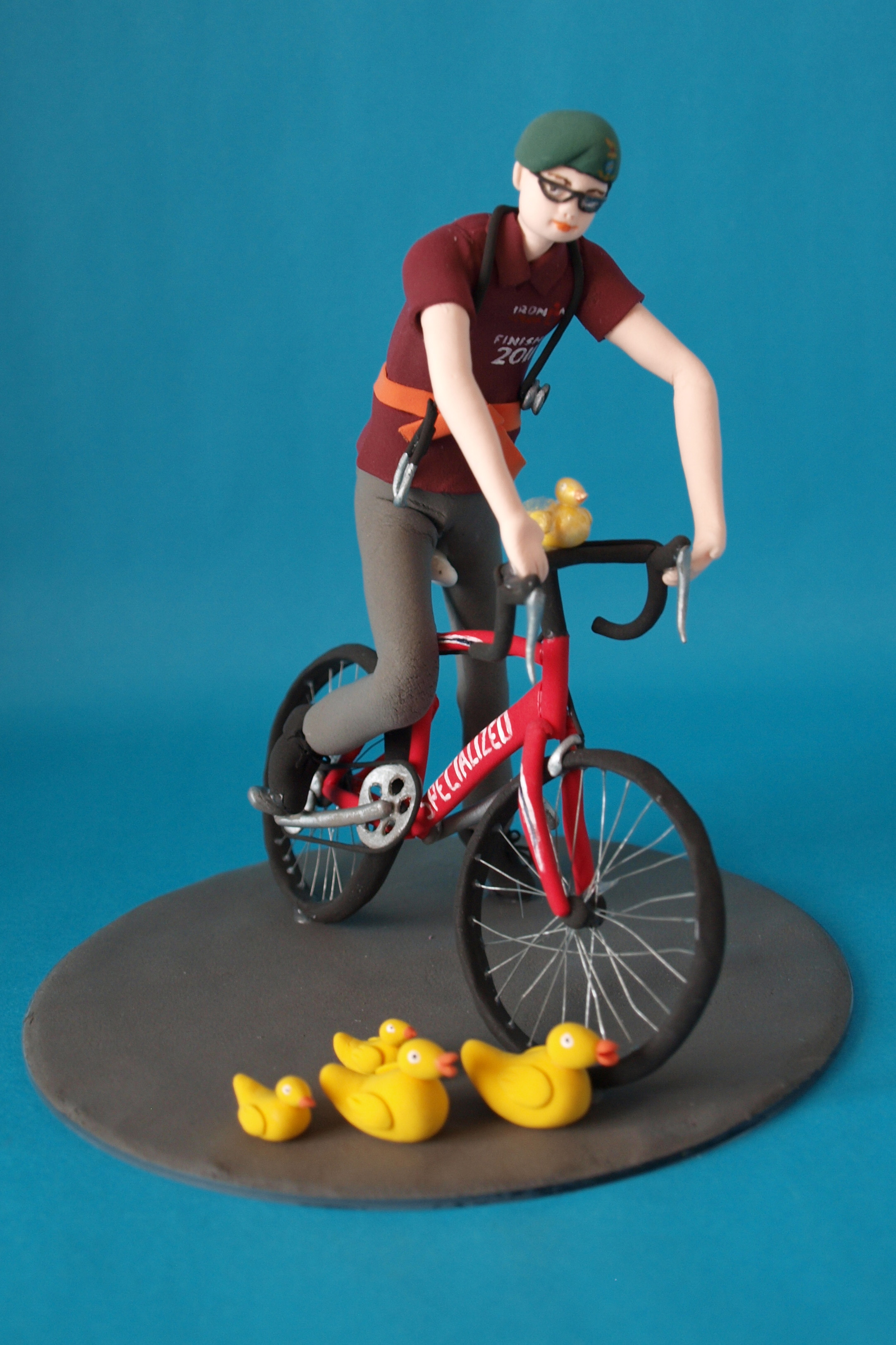 Man on a bicycle birthday cake topper by Louisa Hill