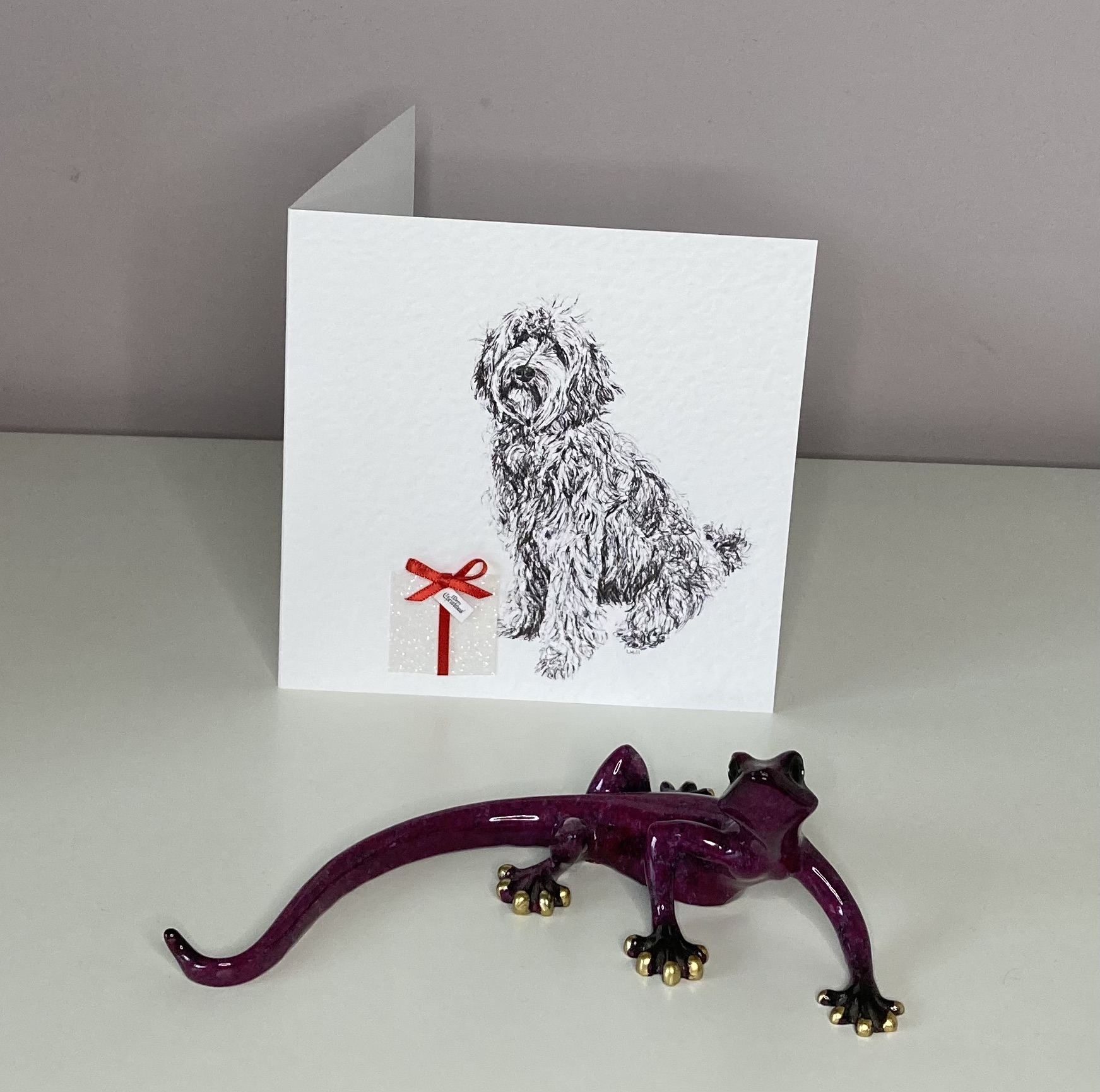 Ladradoodle with Christmas present Christmas card by Louisa Hill