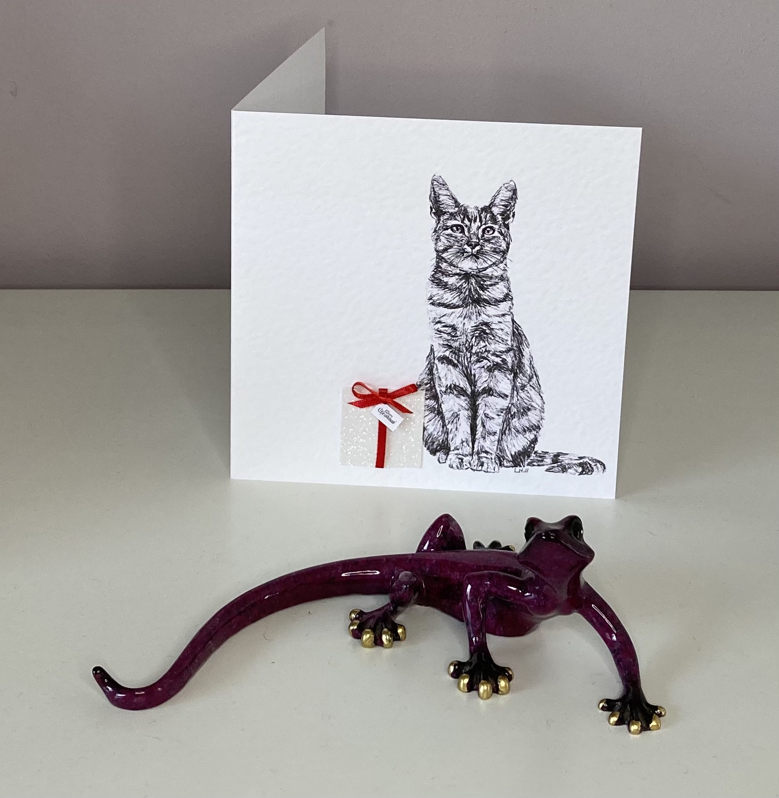 Tabby with Christmas present Christmas card by Louisa Hill