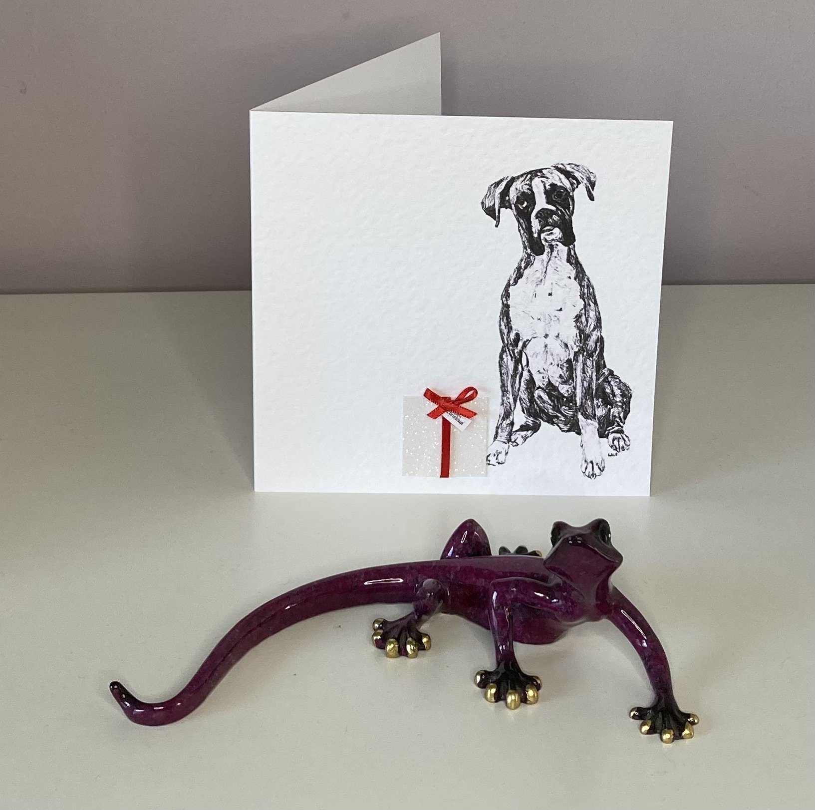 Boxer with Christmas present Christmas card by Louisa Hill