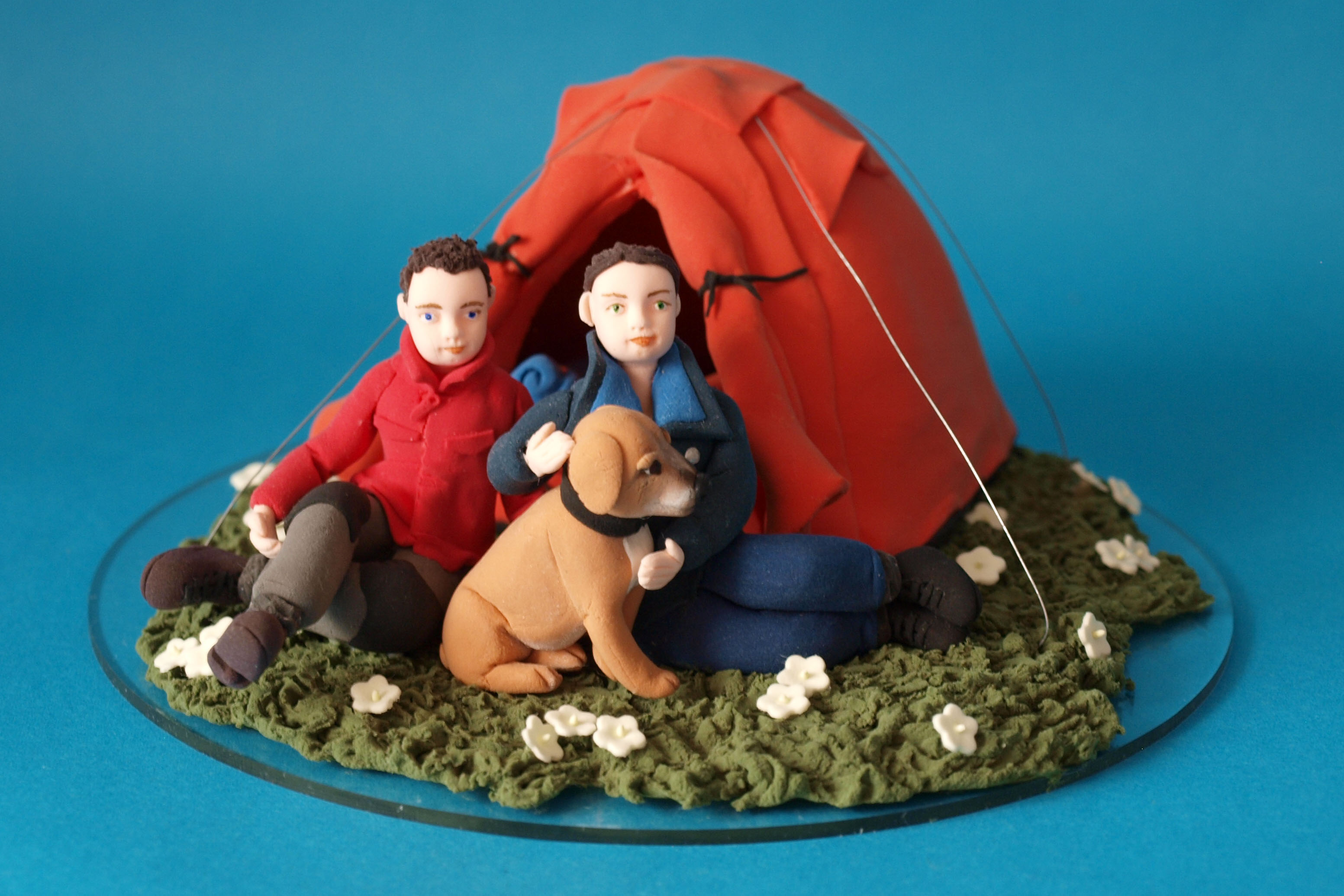 Camping bride and groom with a dog and tent wedding cake topper by Louisa Hill