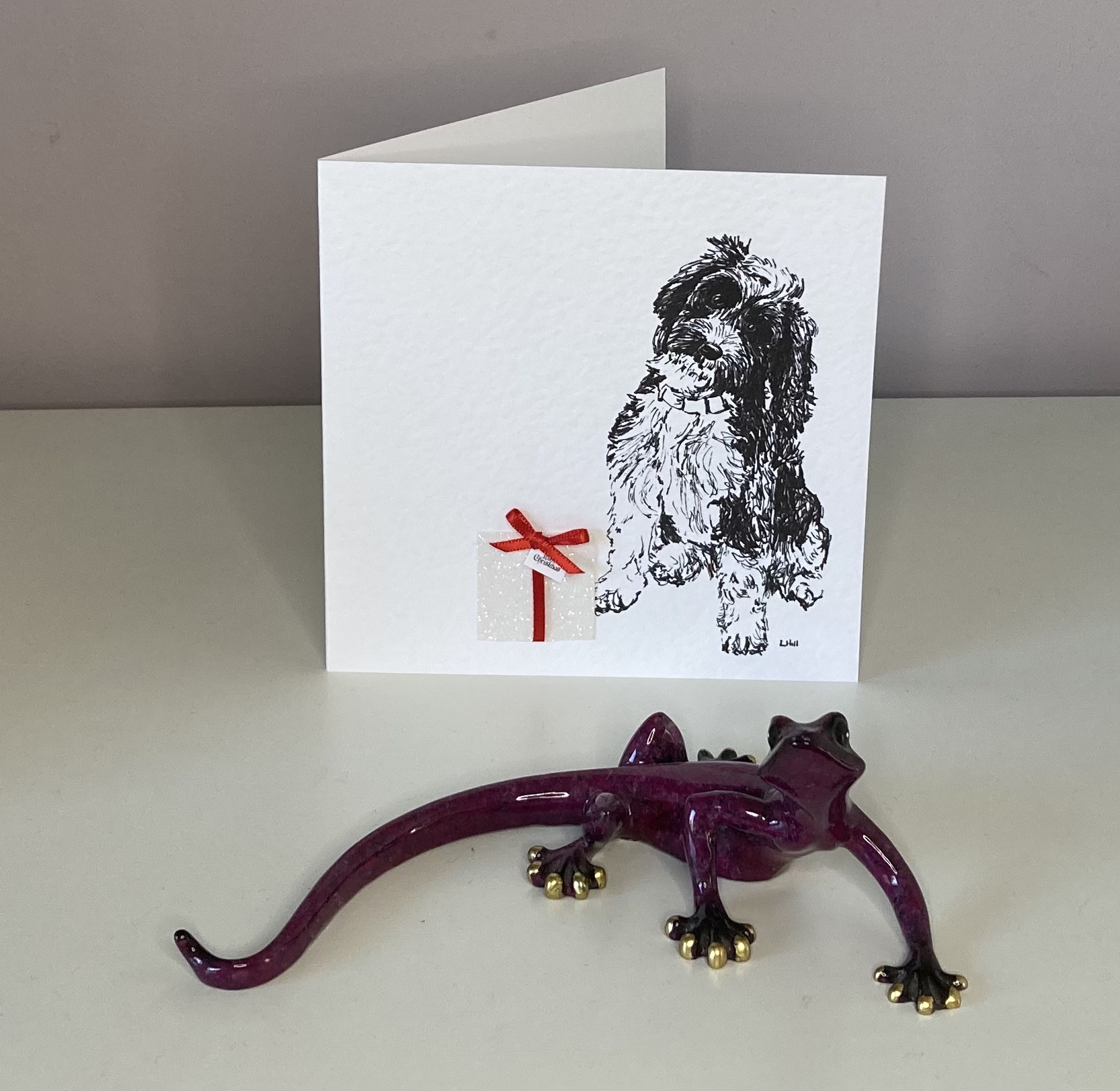 Cockapoo with Christmas present Christmas card by Louisa Hill