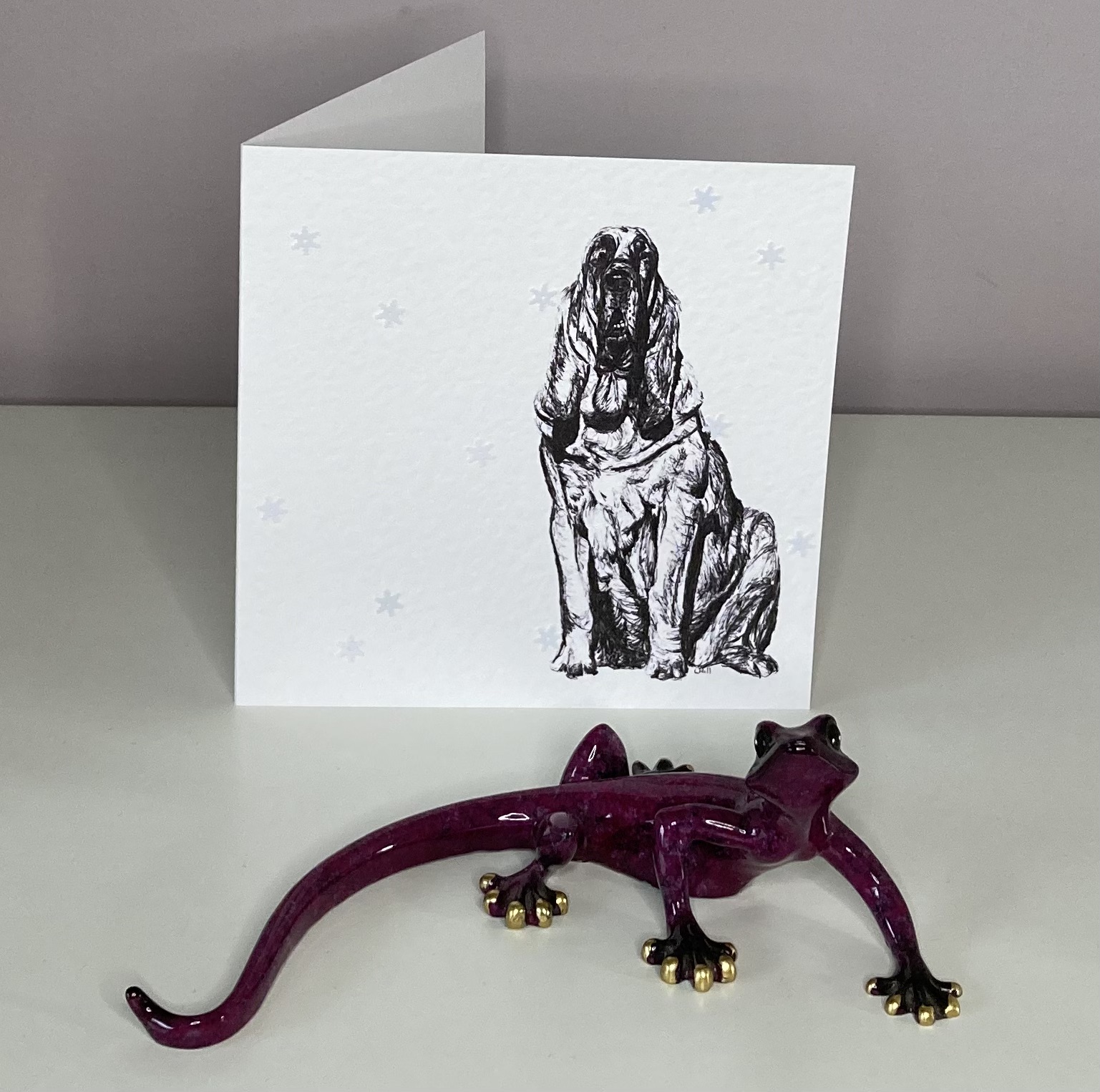 Bloodhound with snowflakes Christmas card by Louisa Hill