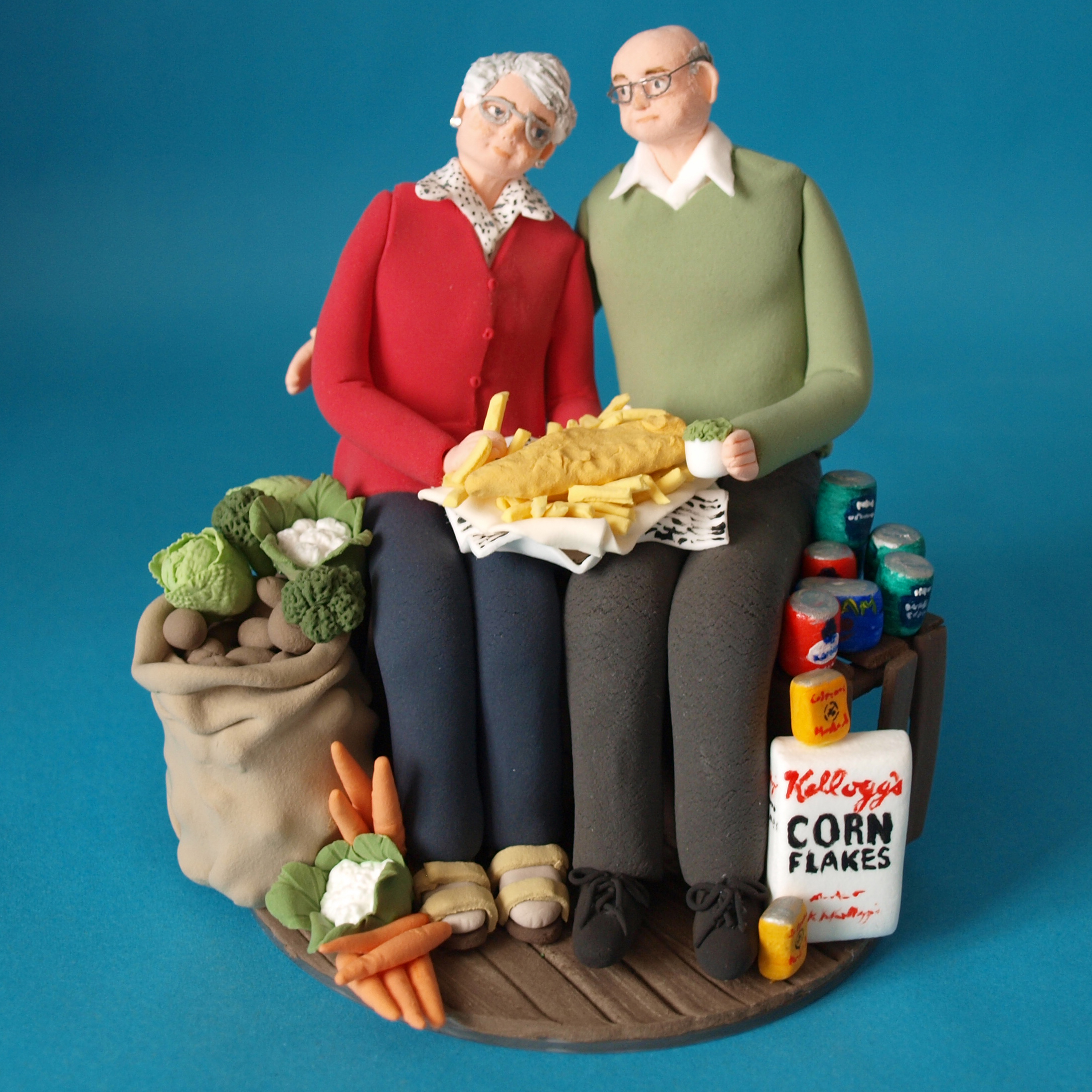 Old couple, shopkeepers, fish and chipshop, wedding anniversary cake topper by Louisa Hill