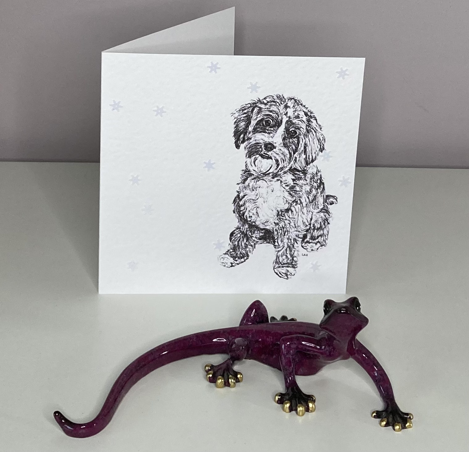 Cavapoo with snowflakes Christmas card by Louisa Hill