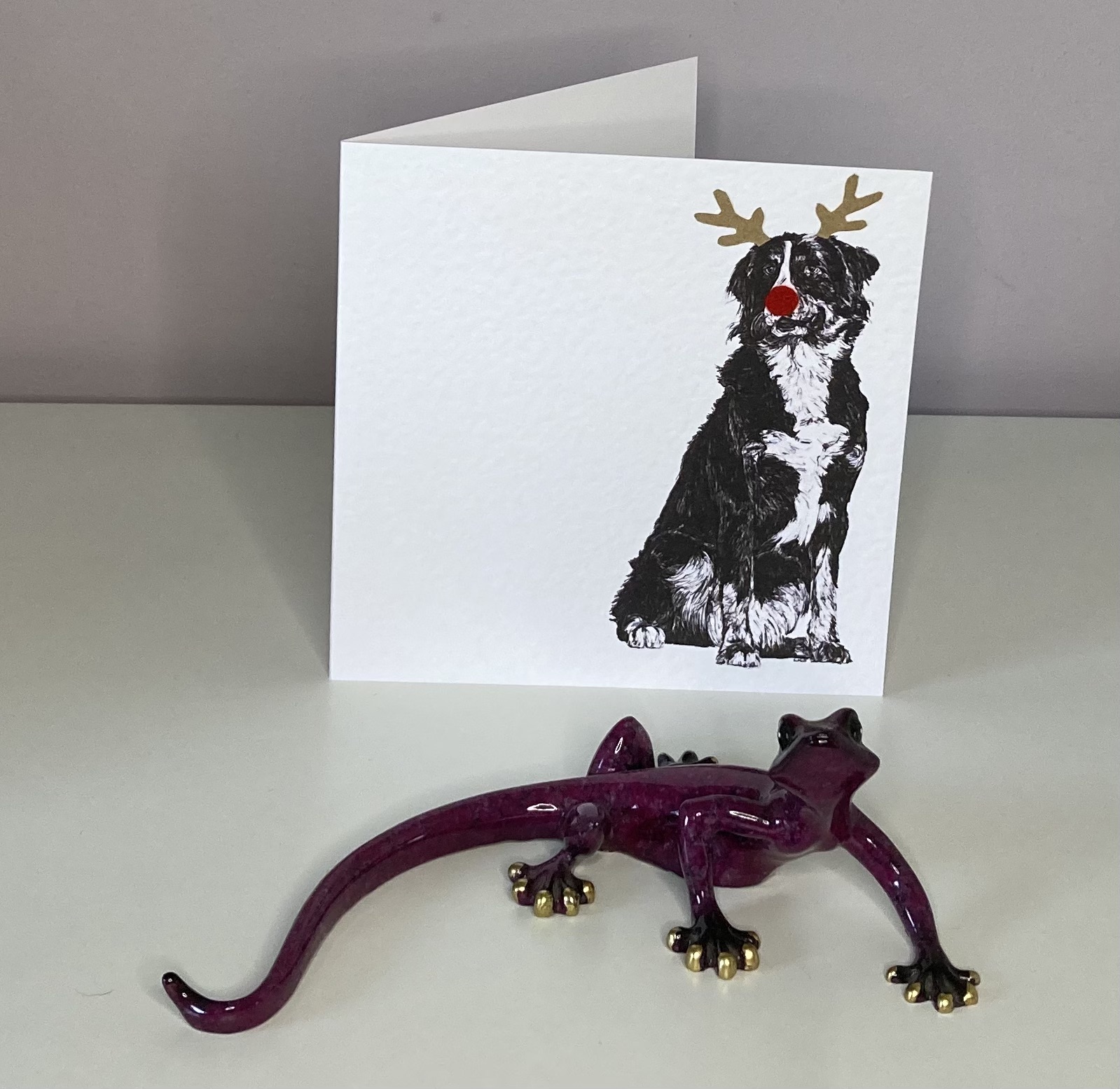 Young Bernese Mountain with reindeer antlers and red nose Christmas card by Louisa Hill