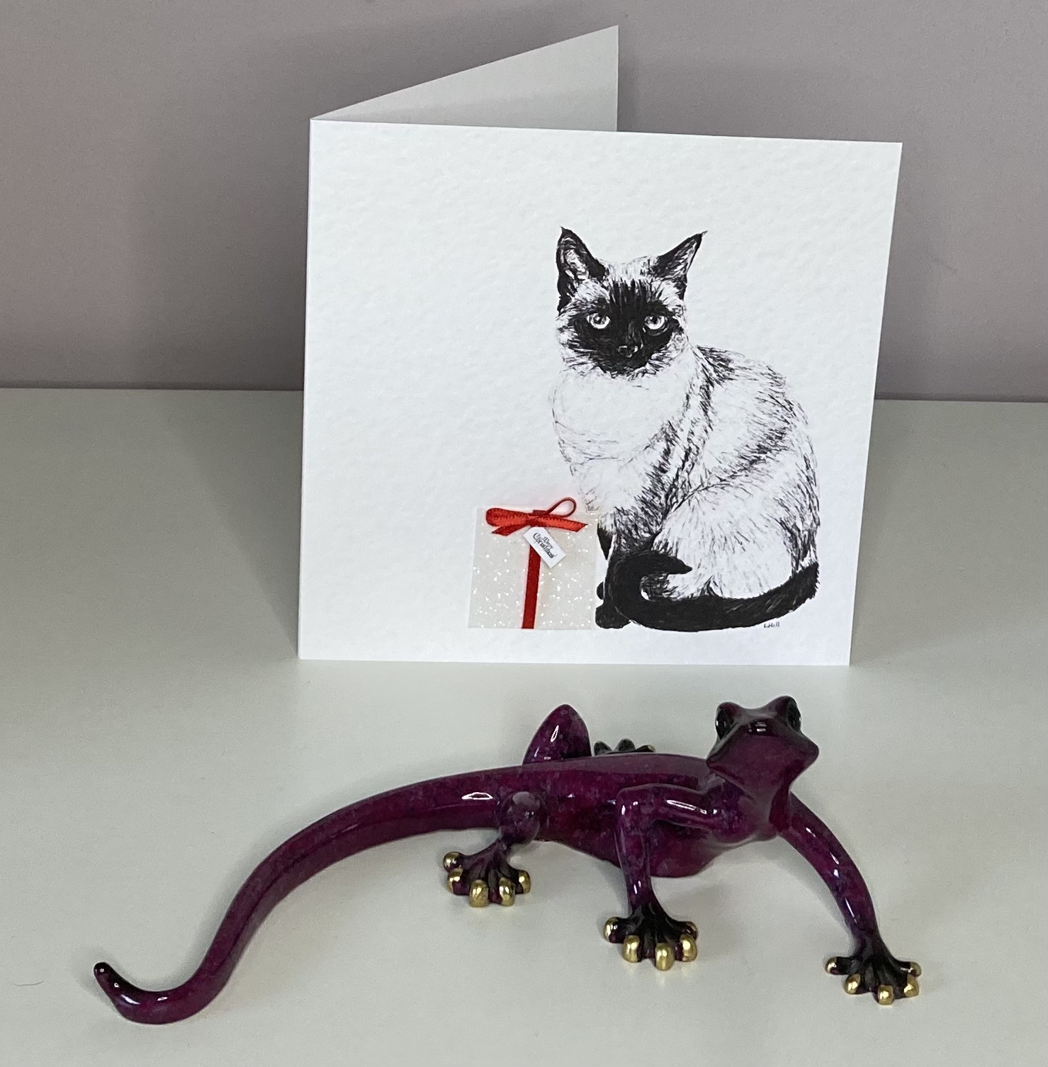 Siamese with Christmas present Christmas card by Louisa Hill