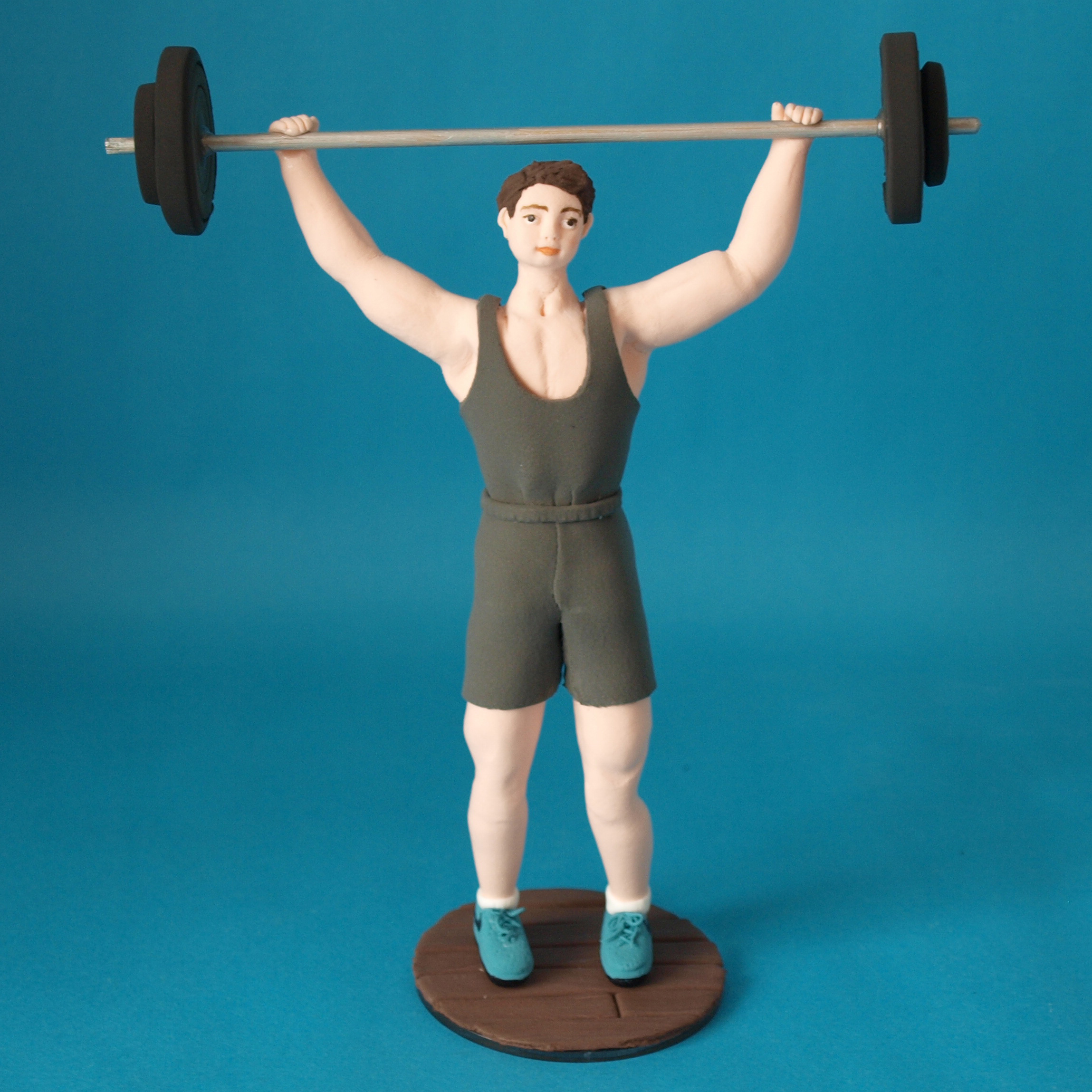 Weightlifter birthday cake topper by Louisa Hill