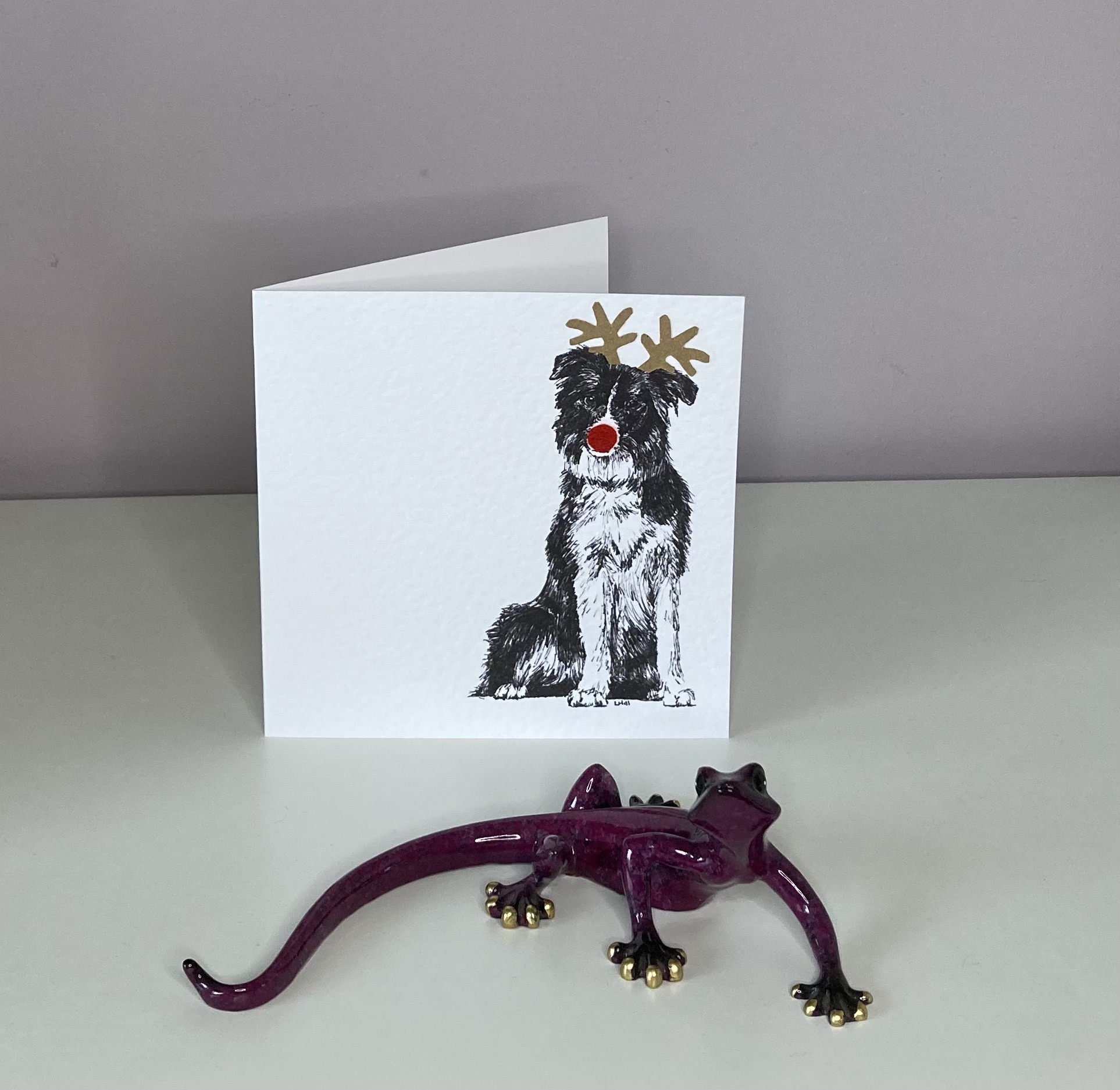 Border Collie with reindeer antlers and red nose Christmas card by Louisa Hill