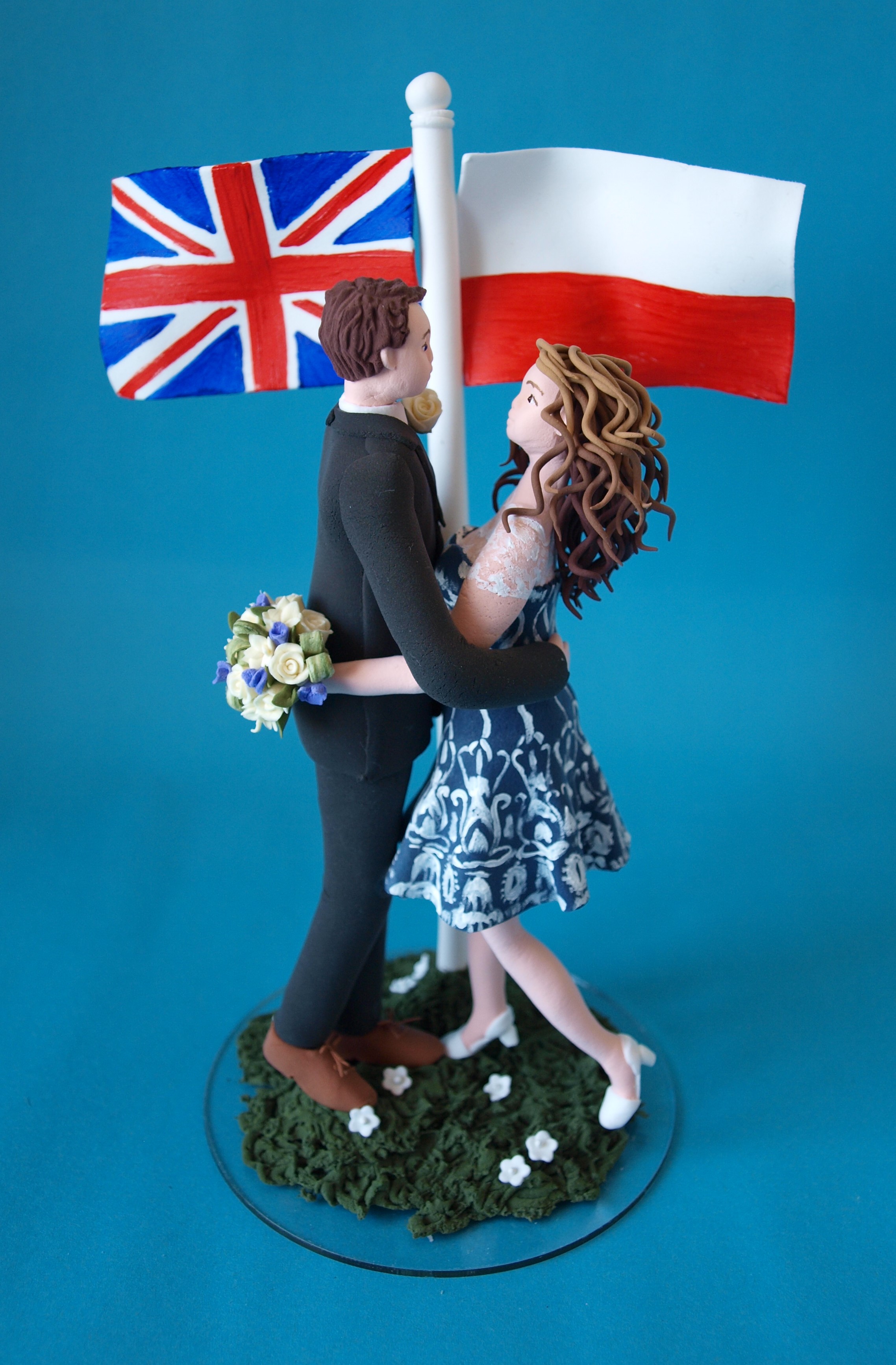 Bride and groom with flags wedding cake topper by Louisa Hill