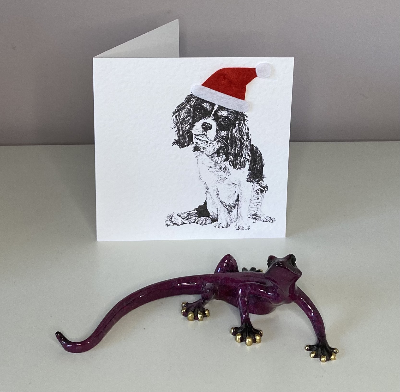 Cavalier King Charles Spaniel with Santa hat Christmas card by Louisa Hill