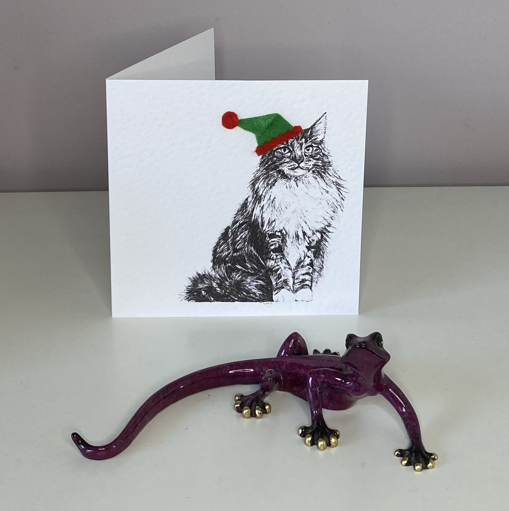 Norwegian Forest with elf hat Christmas card by Louisa Hill