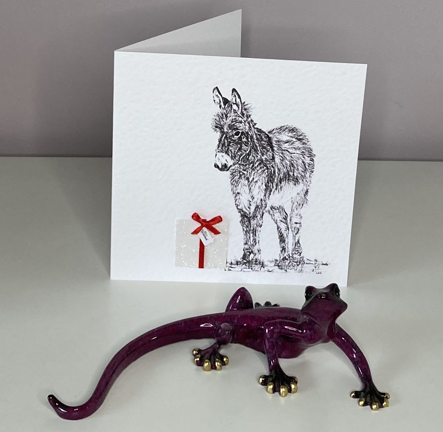 Donkey with Christmas present Christmas card by Louisa Hill