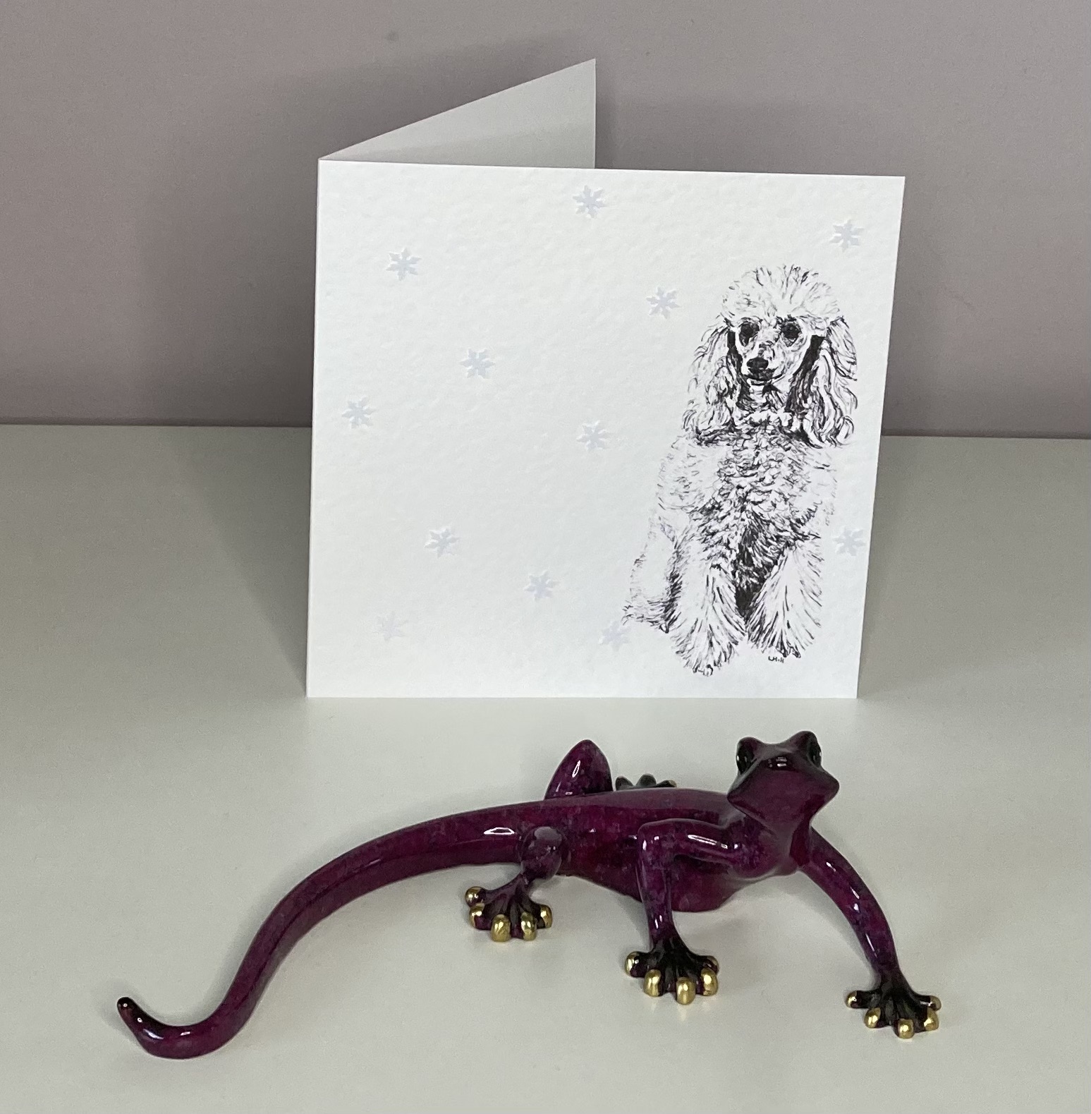 Poodle with snowflakes Christmas cards by Louisa Hill