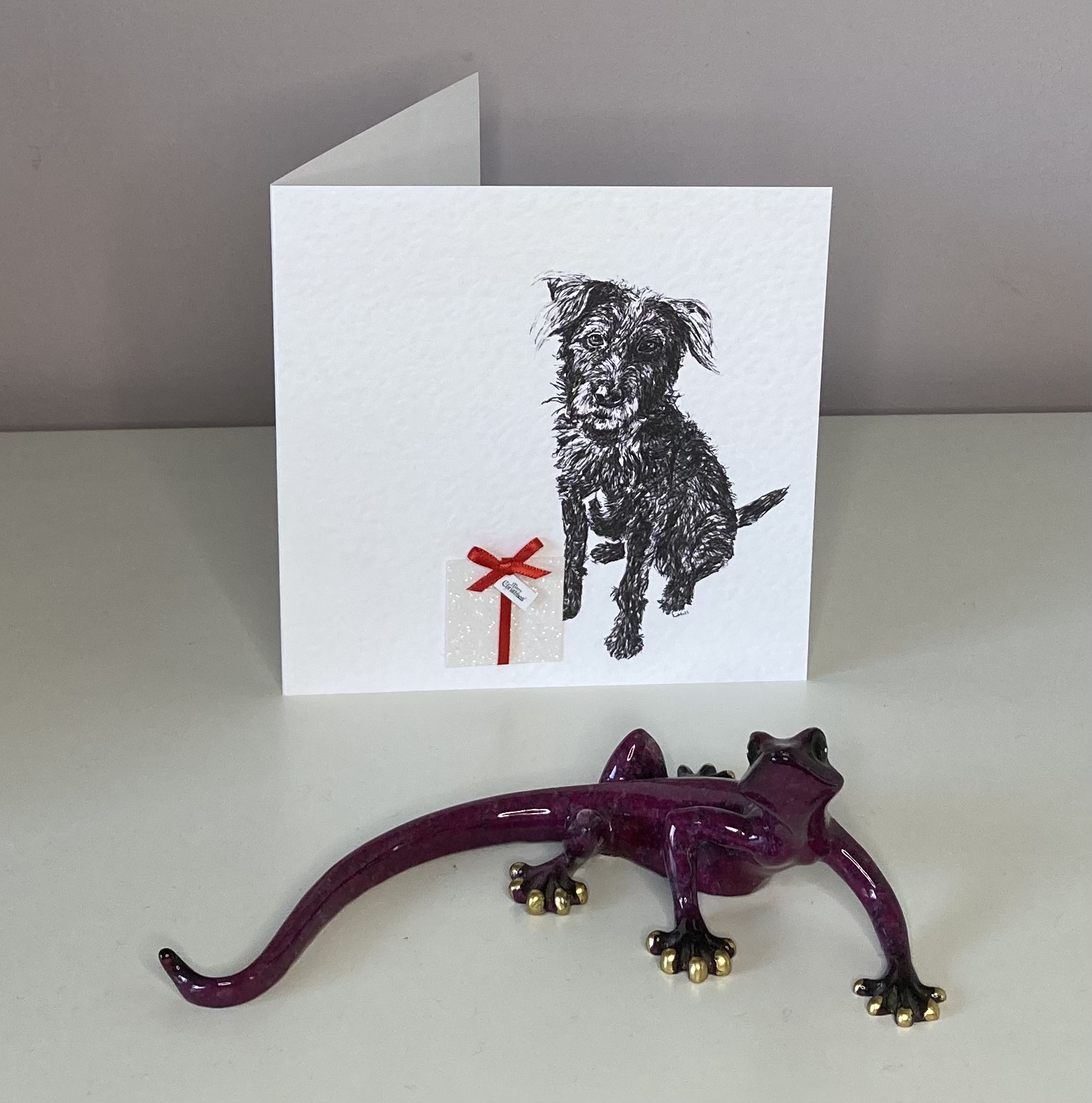 Patterdale Terrier with Christmas present Christmas card by Louisa Hill