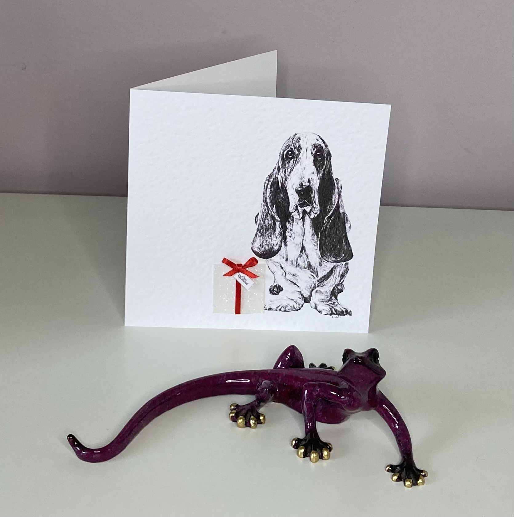 Basset Hound with Christmas present Christmas card by Louisa Hill