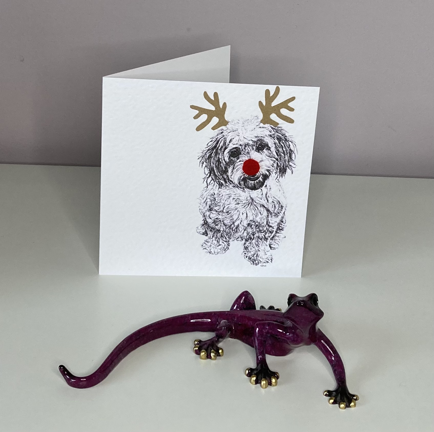 Cavachon with reindeer antlers and red nose Christmas card by Louisa Hill