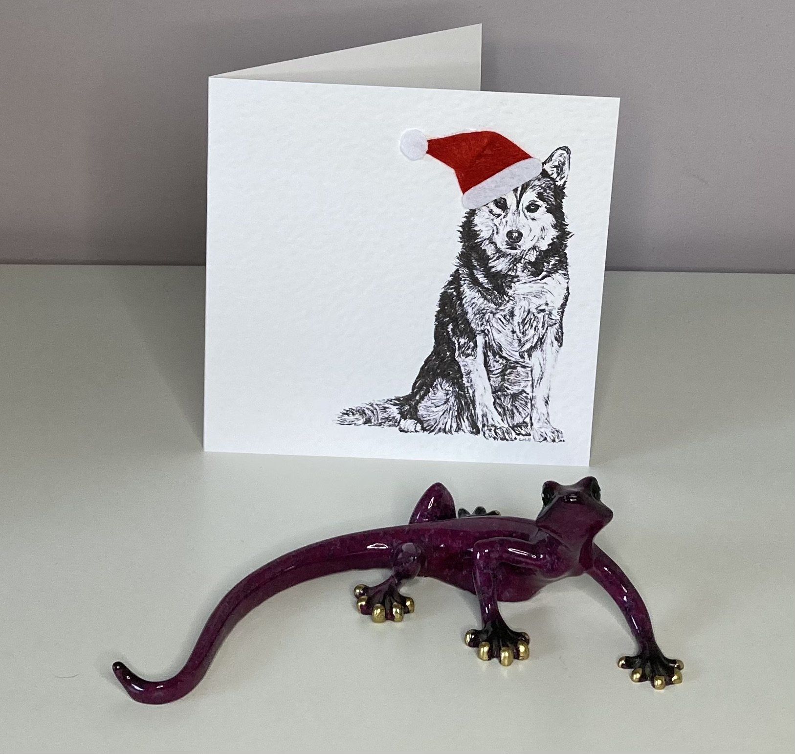 Siberian Husky with Santa hat Christmas card by Louisa Hill